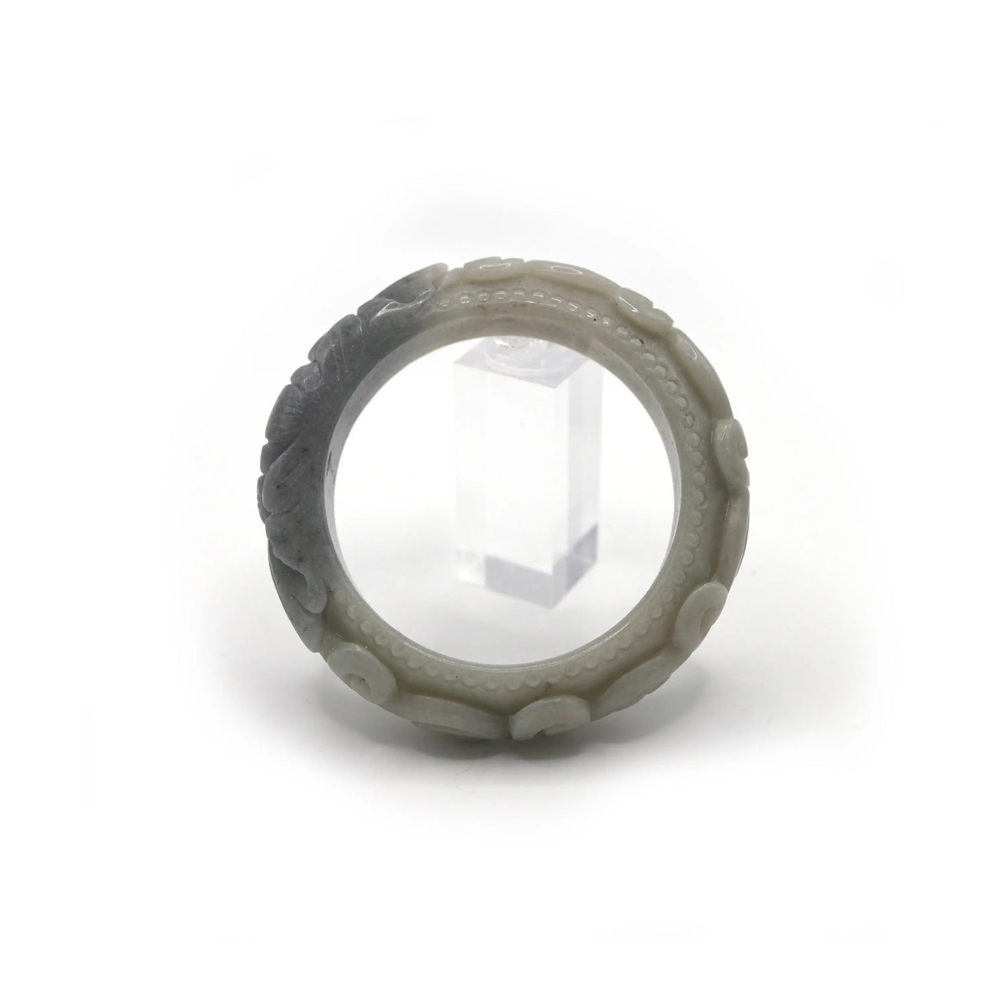 Matte-finished jade bangle with structured edges, cloud rings, and a central black floral motif, merging symbolism with sculptural form – Miruzi