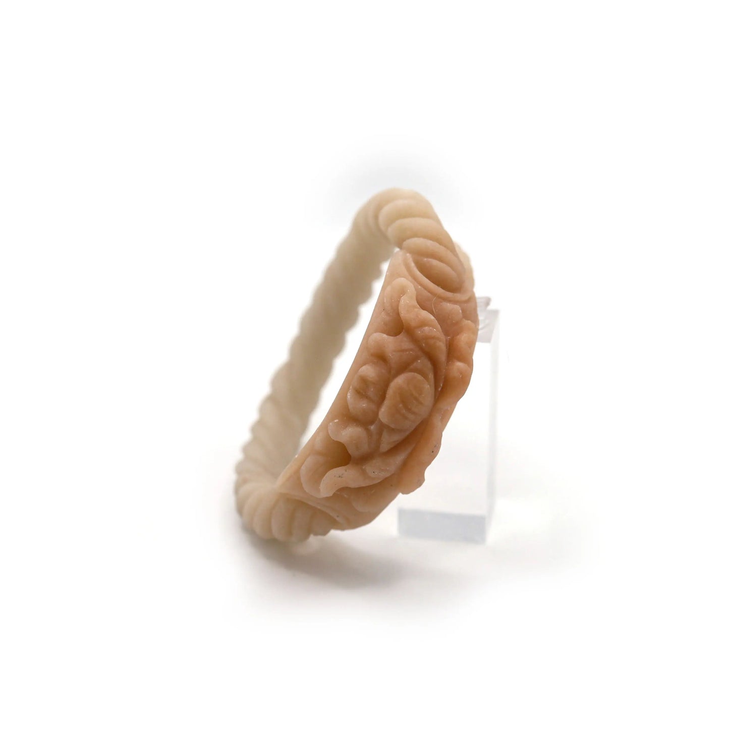 Elegant jade bracelet featuring a soft twist design in beige paired with a dimensional peony carving on a rich caramel-toned plaque – Miruzi