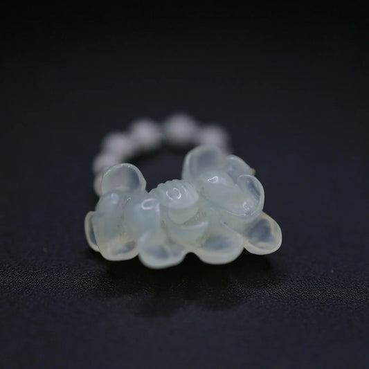 Handcrafted Serene Aqua Peony Adjustable Ring featuring a translucent, ice-clear serpentine base infused with a hint of pale aqua, showcasing a beautifully carved, three-dimensional peony. Perfect for summer, this ring combines ethereal beauty with the art of detailed craftsmanship, ideal for adding a touch of dreamy elegance to any outfit.