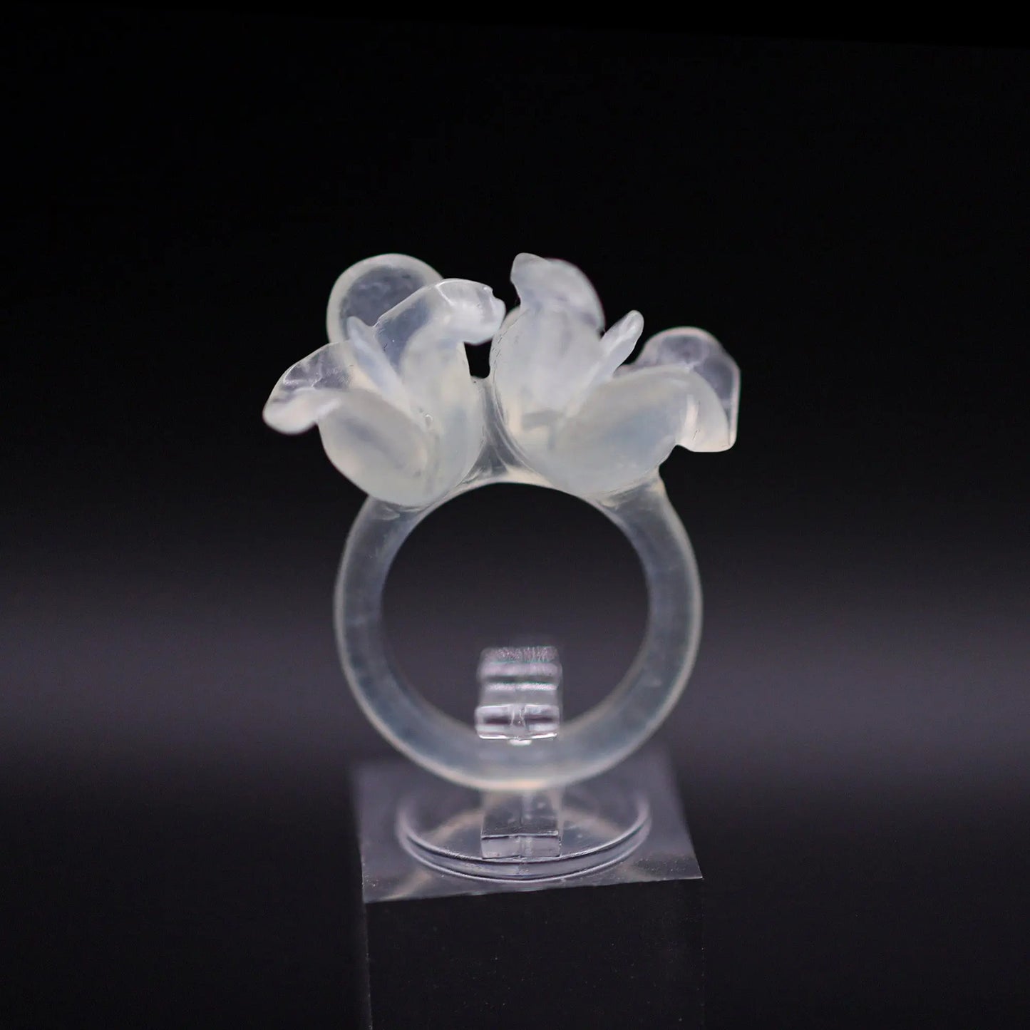Sublime Ice Magnolia Serpentine Ring featuring crystal-clear serpentine intricately carved into three-dimensional magnolia blossoms, symbolizing purity and natural beauty. The icy, translucent base enhances the floral details, making it a perfect blend of artistry and elegance.