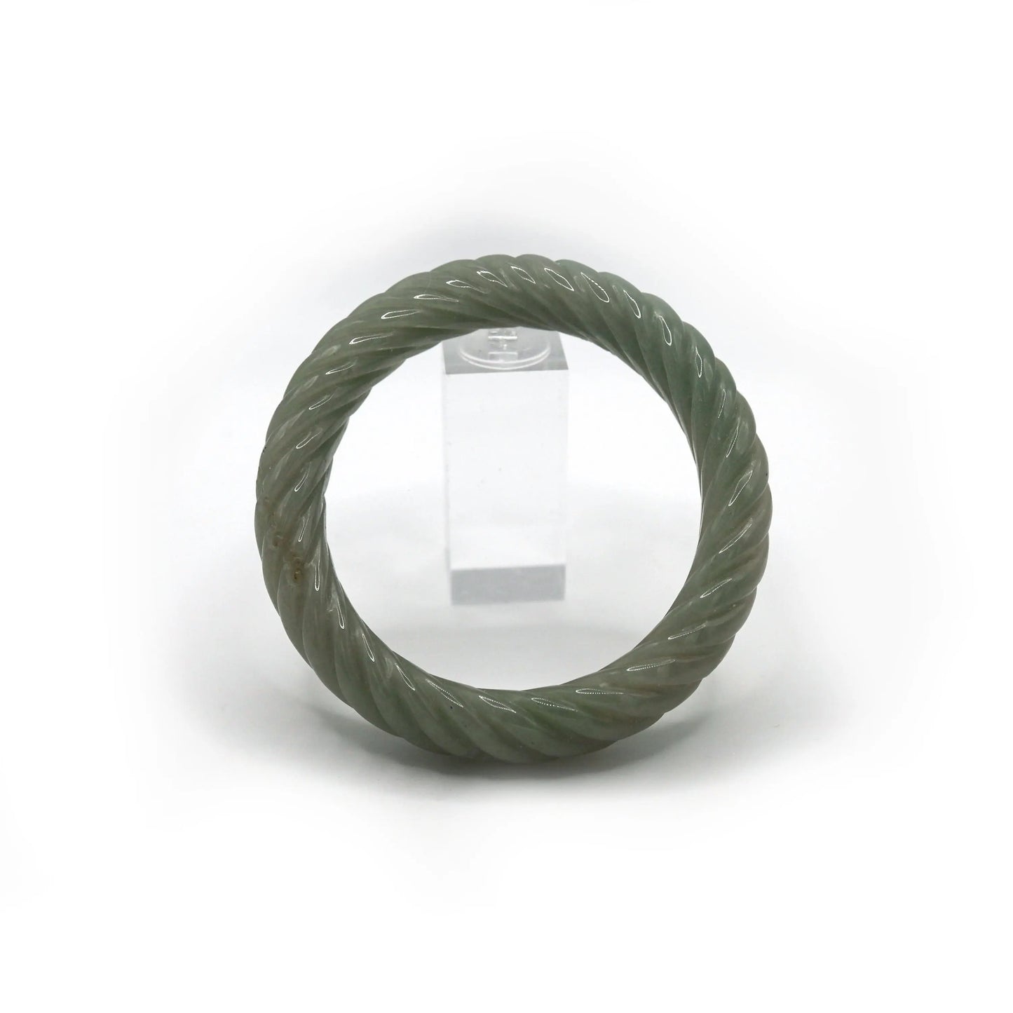 Smooth and spiraling jade bangle in gentle green tones, with two Yuanbao shapes hidden in the continuous arc – Miruzi