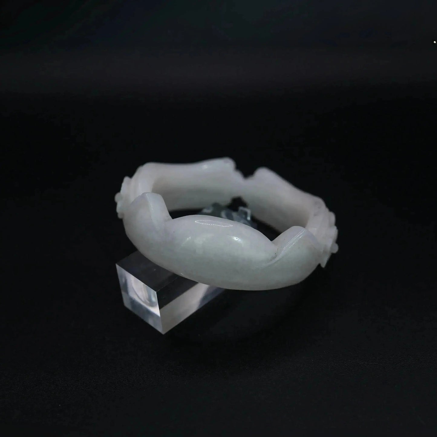 Petite jade bangle carved from natural white Mongolian stone with feline ear shapes and floral touches, perfect for soft styling – Miruzi