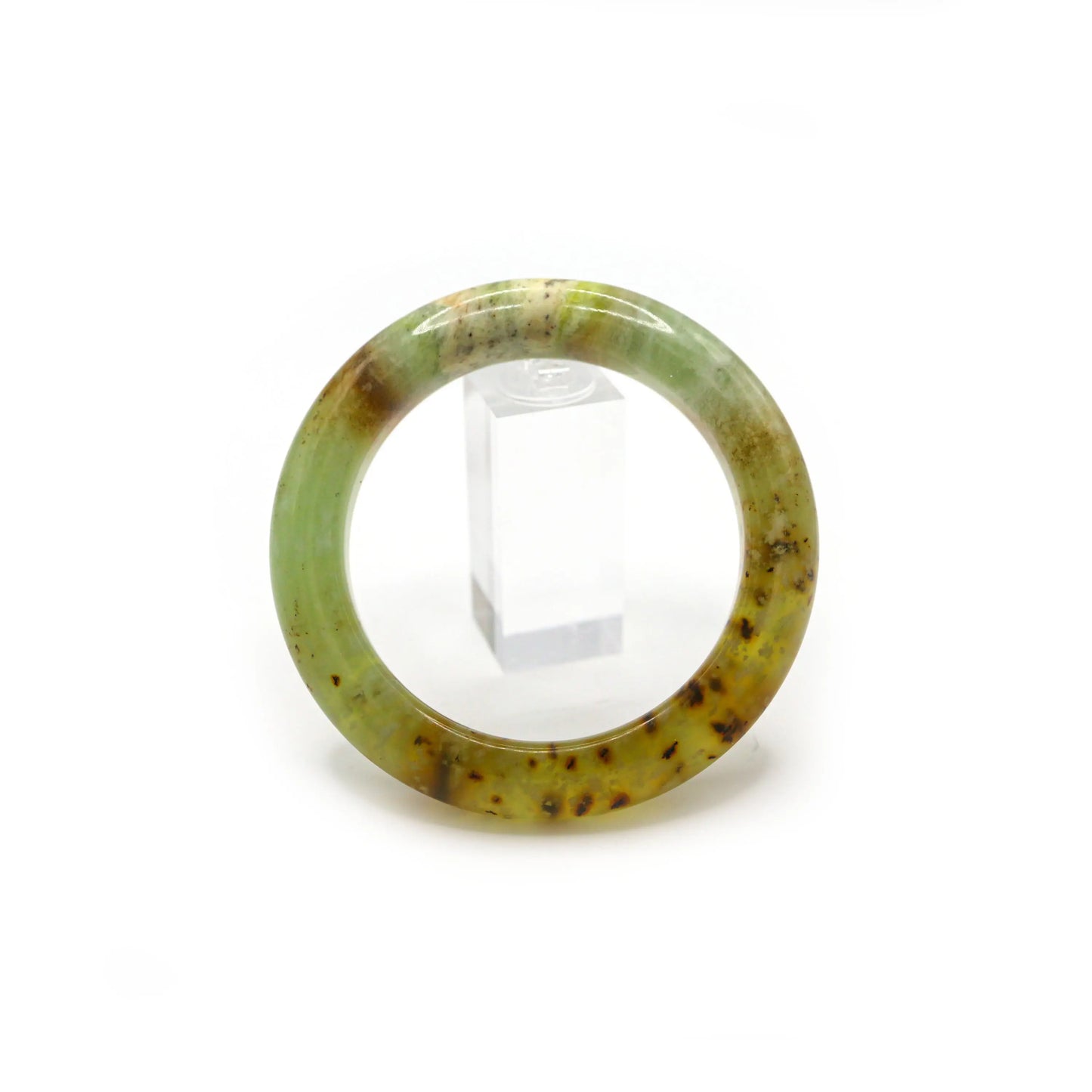 Classic round honey jade bangle on white background showing color gradient Miruzi