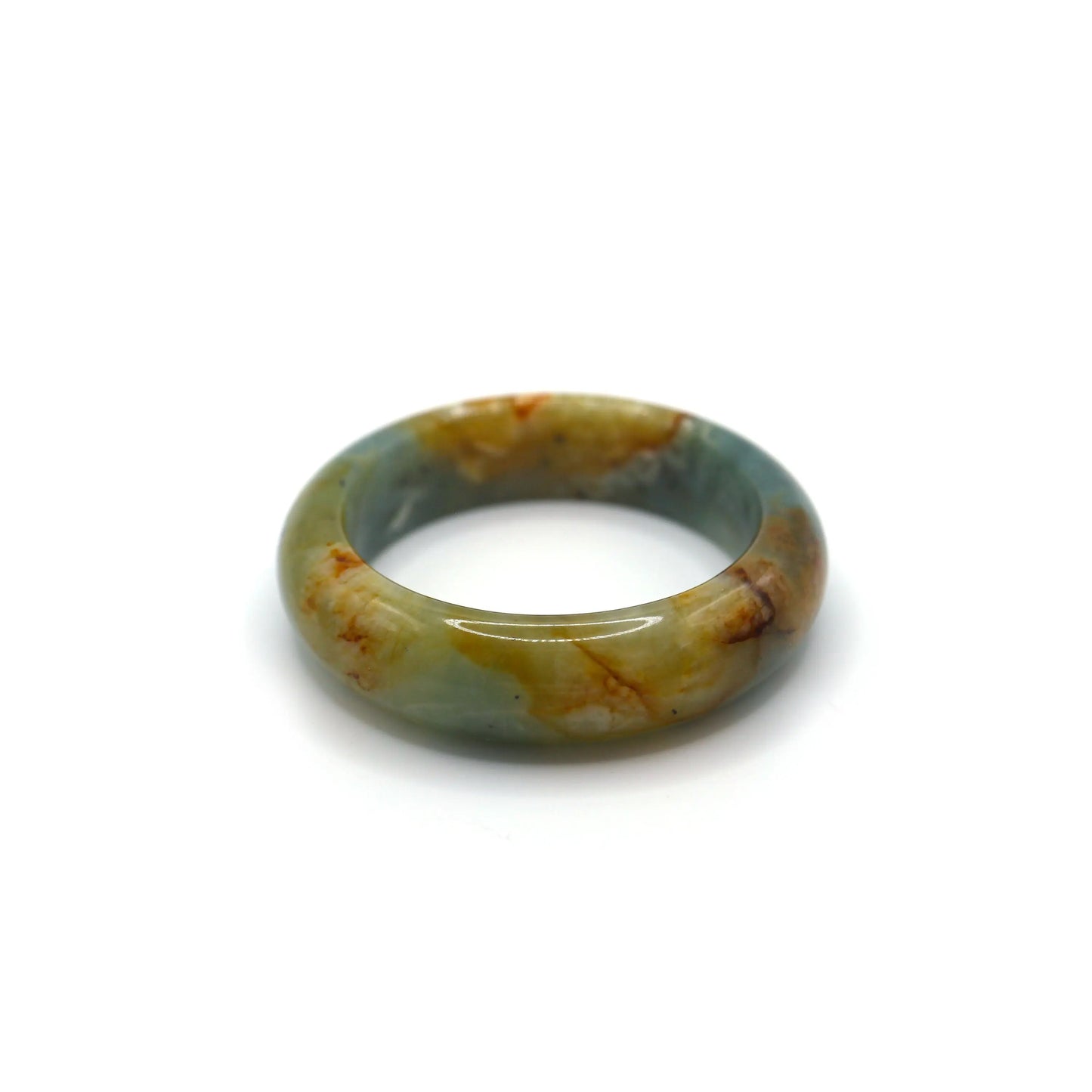 Jade bracelet glowing in daylight with soft blue tones and natural stream-like white and gold mineral patterns across the surface – Miruzi