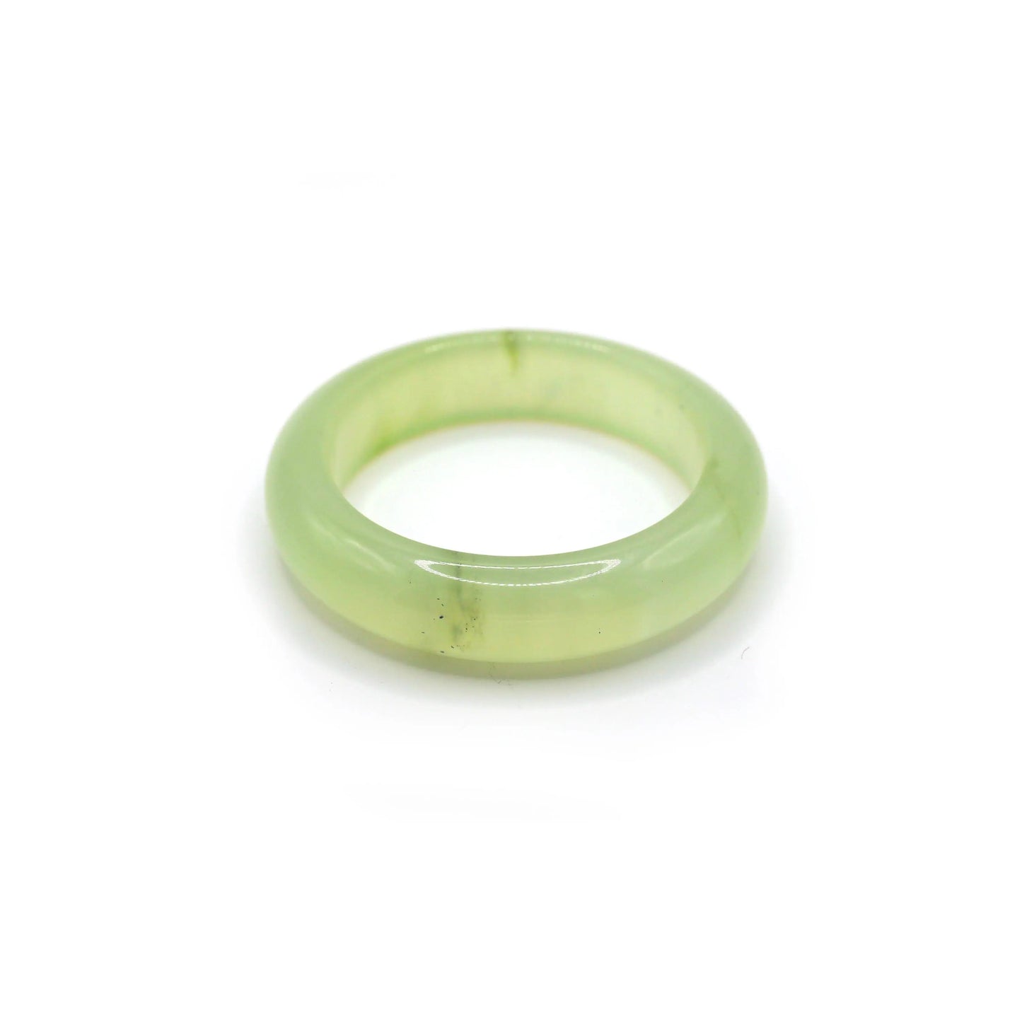 Light green jade bangle glowing softly under daylight, with no visible inclusions and a smooth, liquid-like finish – Miruzi