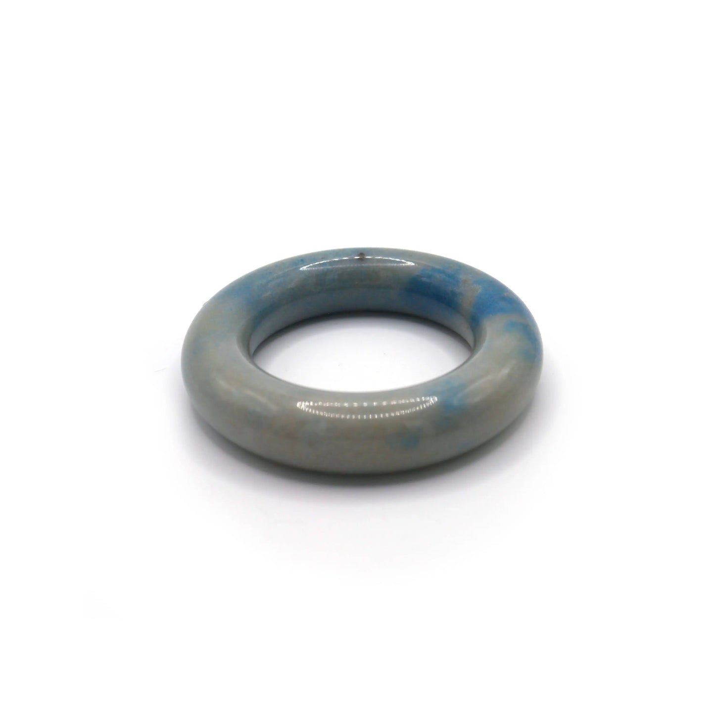 Quarzite jade bangle with gentle blue markings on a milky white body, carved into a balanced and breathable donut silhouette – Miruzi