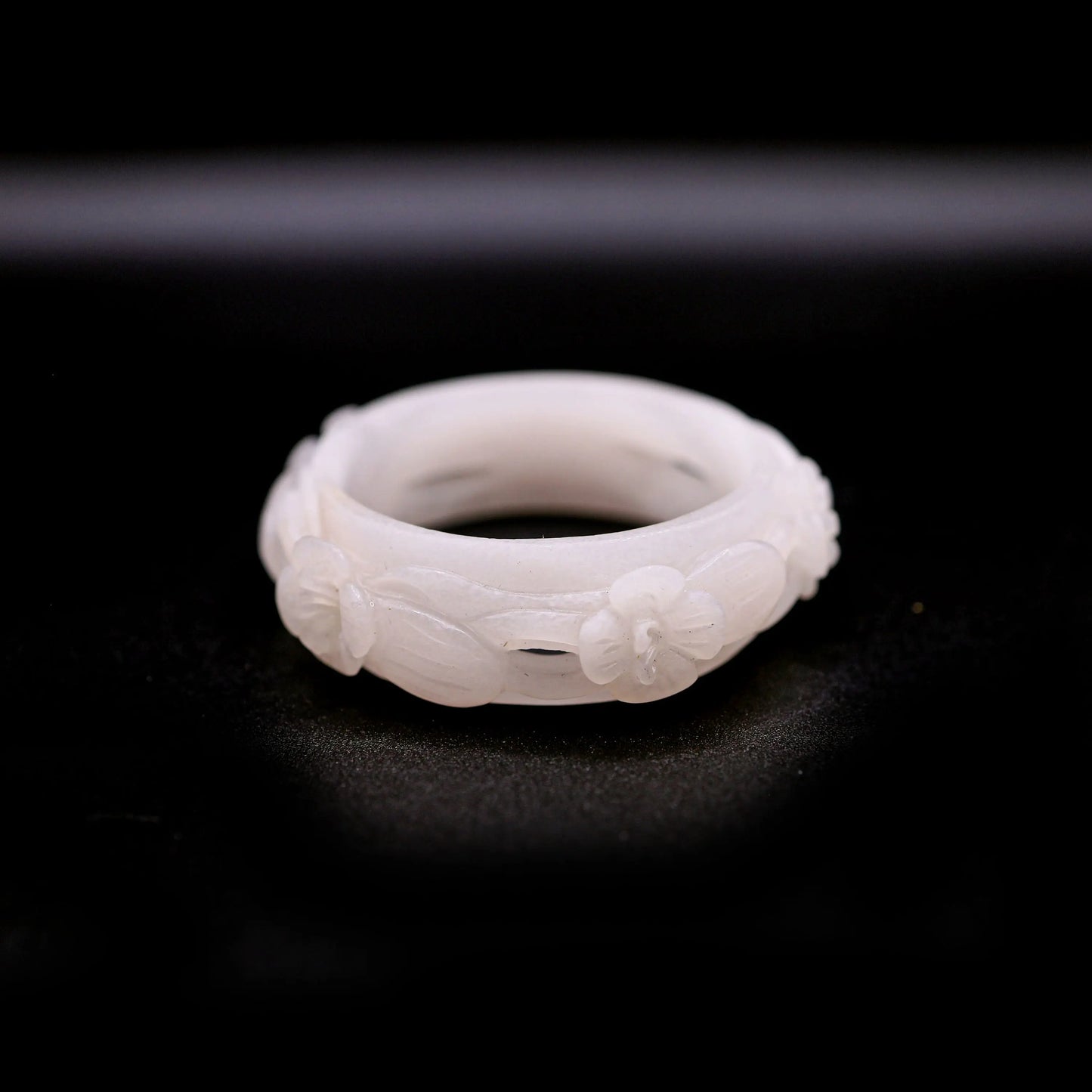 Pure white Mongolian jade bracelet featuring five openwork violet flowers carved in full relief, blending elegance with nature-inspired design – Miruzi