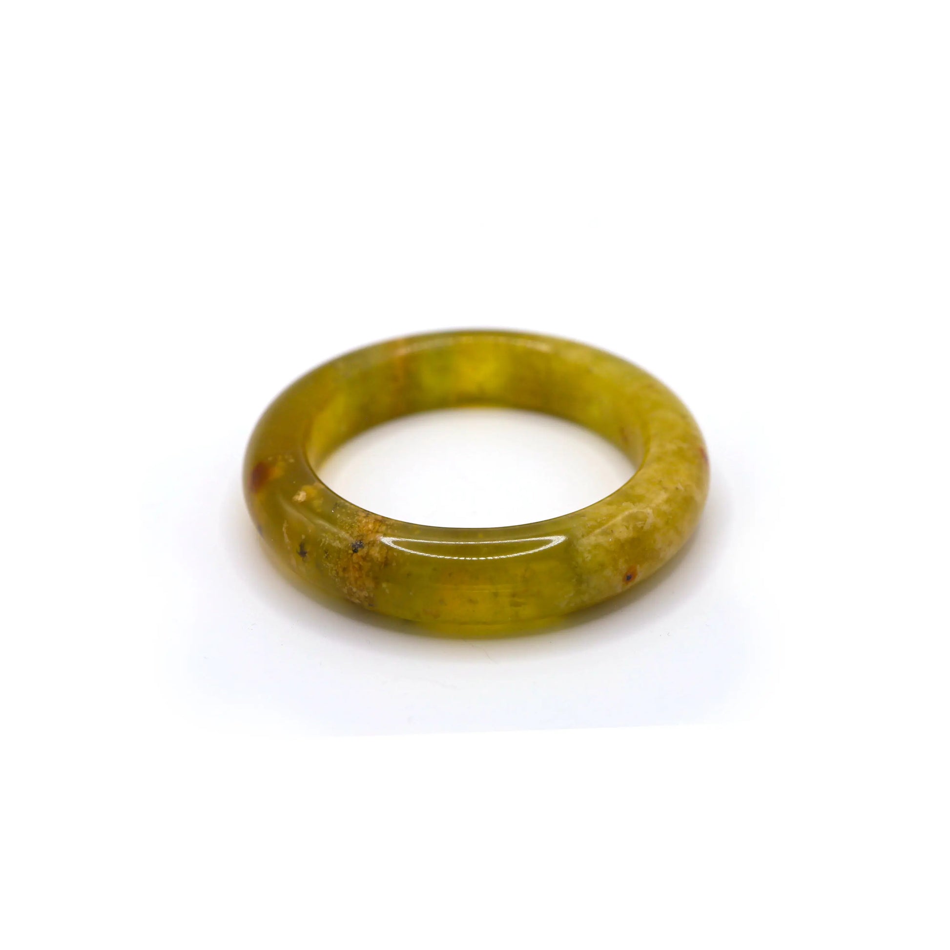 Side view of jade bracelet with soft yellow and white streaks, reminiscent of plant roots or petal veins drifting inside the stone. - Miruzi