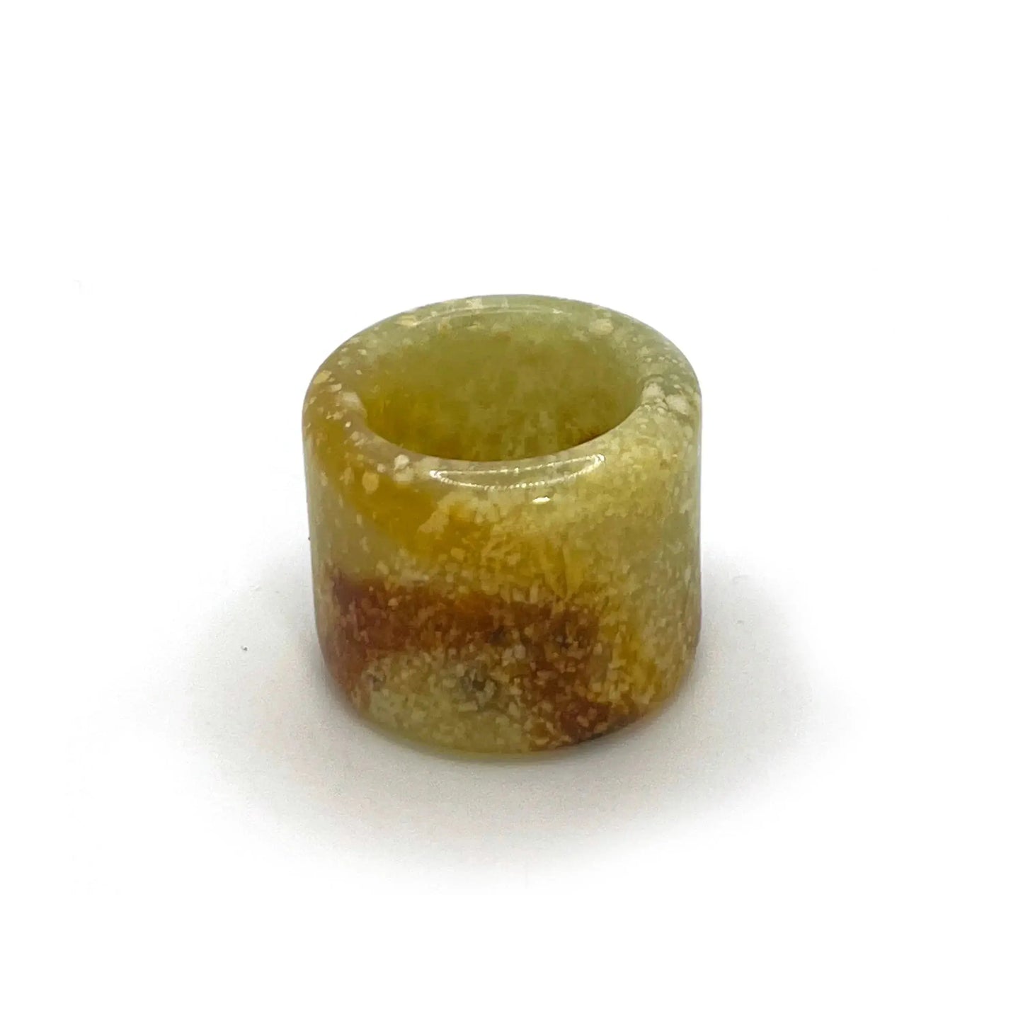 Blizzard Arch lemon yellow thumb ring made from serpentine jade, featuring snowy white patterns and an orange arc—artisan-crafted jade rings for sale.
