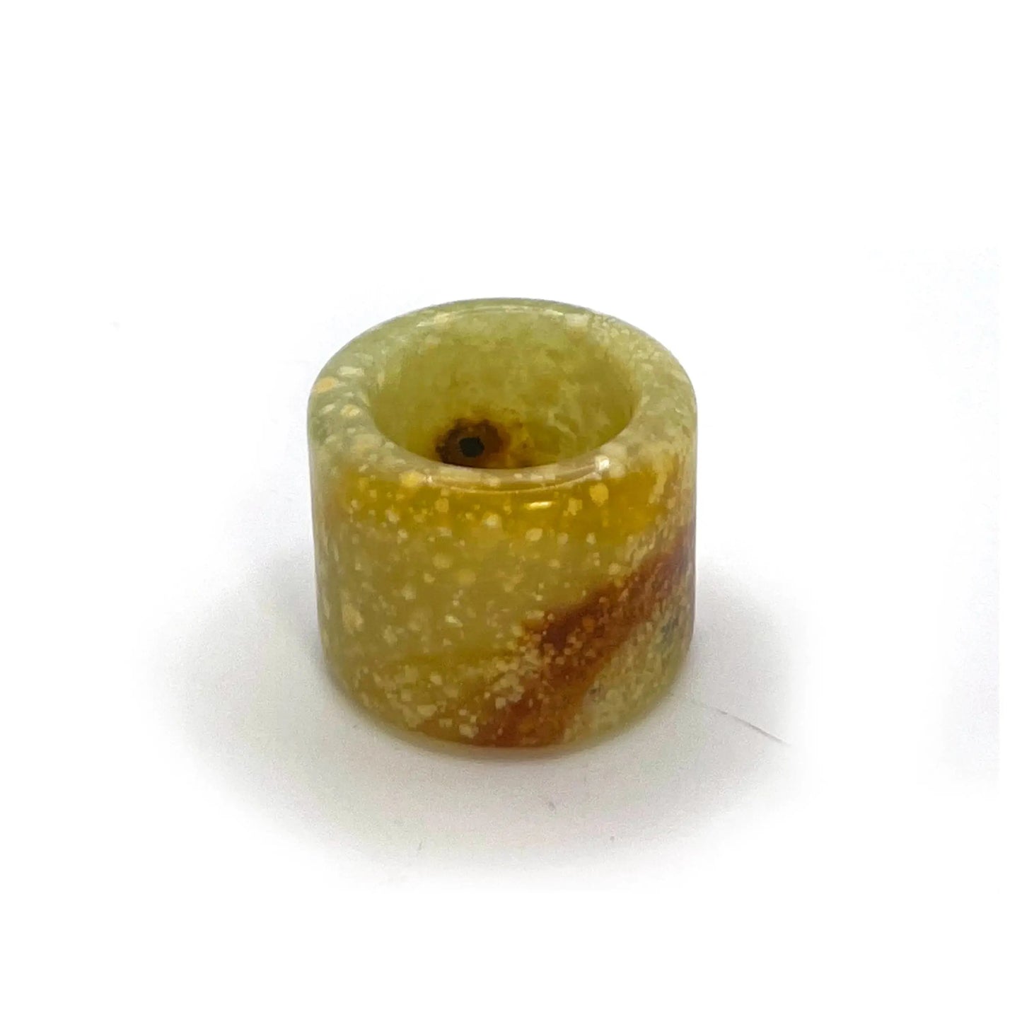 Blizzard Arch lemon yellow thumb ring made from serpentine jade, featuring snowy white patterns and an orange arc—artisan-crafted jade rings for sale.