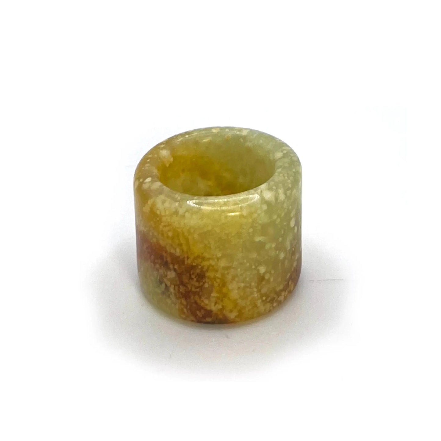 Blizzard Arch lemon yellow thumb ring made from serpentine jade, featuring snowy white patterns and an orange arc—artisan-crafted jade rings for sale.