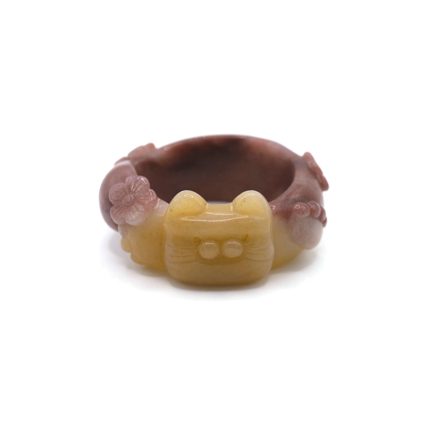 Hand-carved Mongolian jade bracelet with golden yellow and lavender hues, featuring a sculpted cat face, paws, tail, and floral accents in high relief – Miruzi