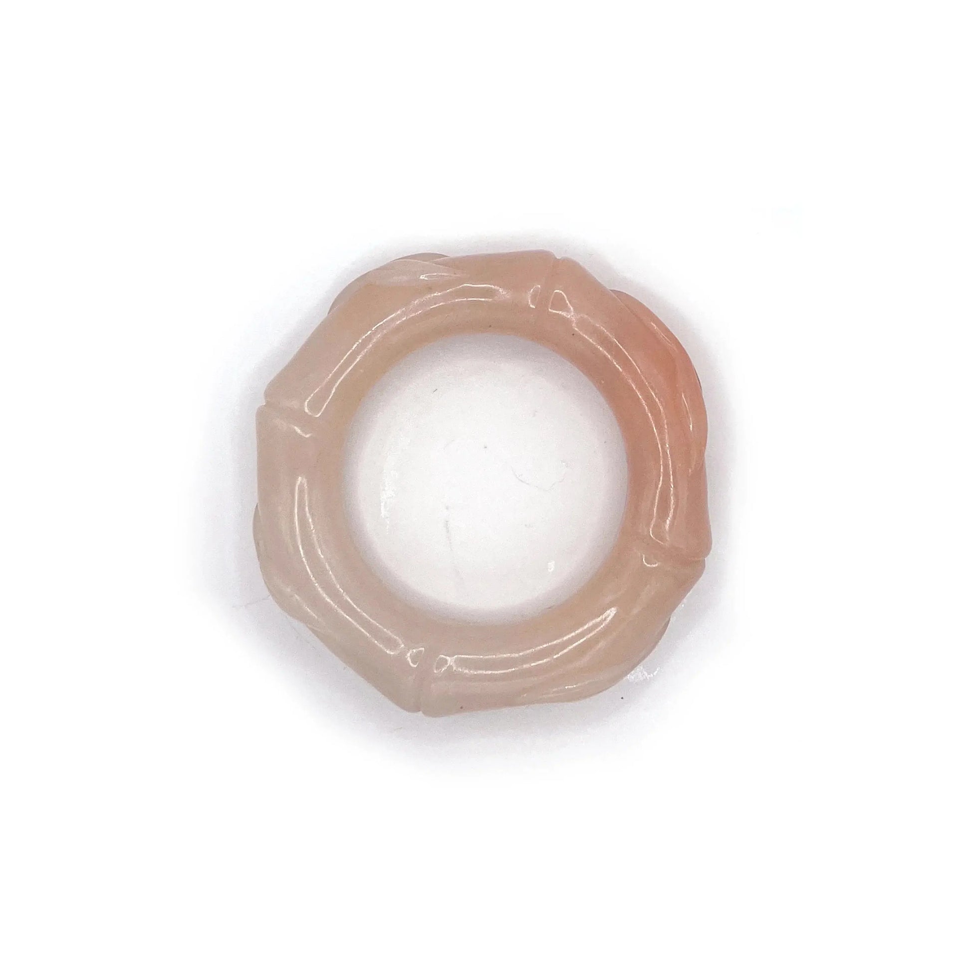 Hand-carved bamboo bangle made from natural Mongolian jade, featuring soft pink, orange, and beige hues with a polished finish and segmented bamboo design.