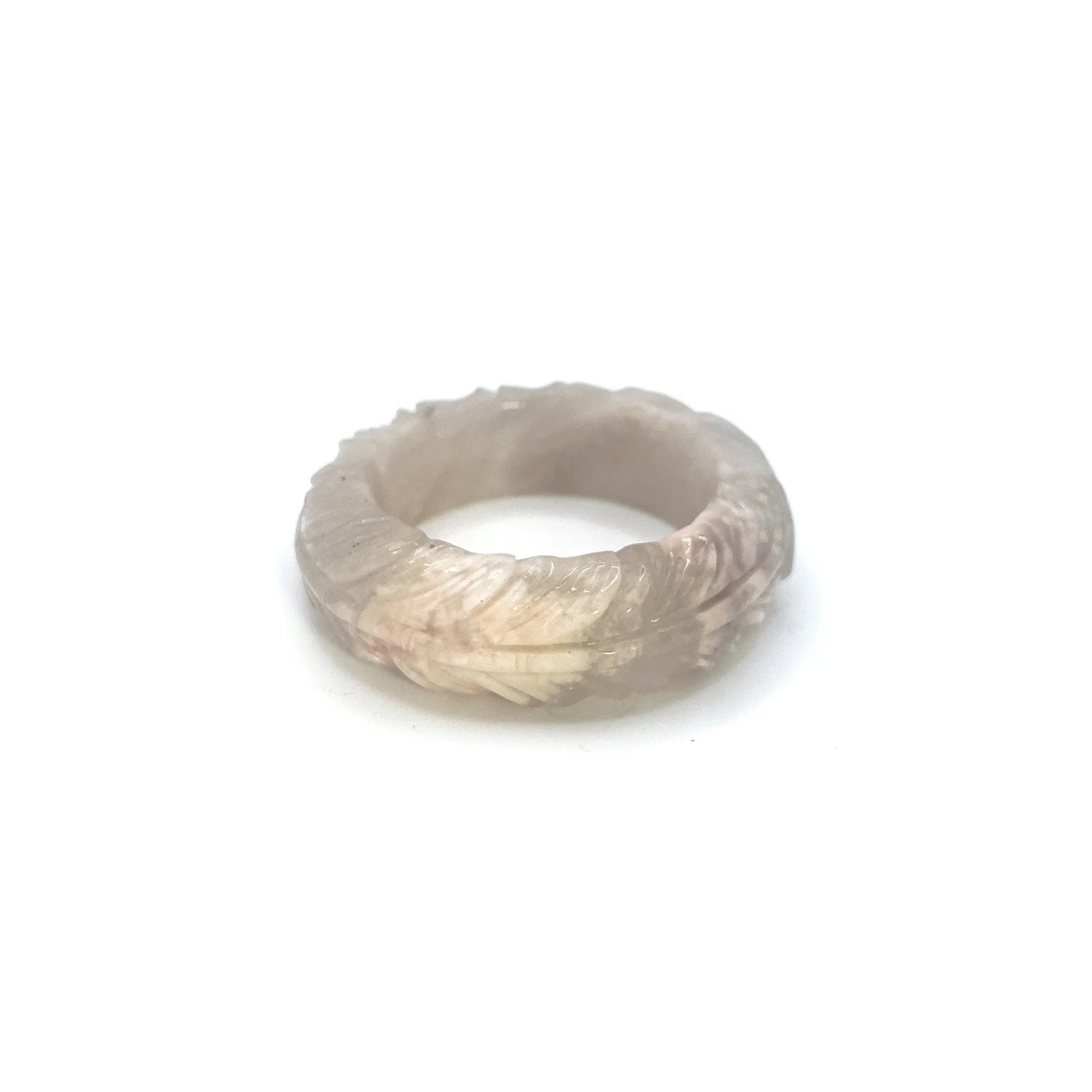 Feather bangle carved from translucent Mongolian jade in ivory, pink, and lavender tones with intricate feather designs and bold, modern shape. - Miruzi