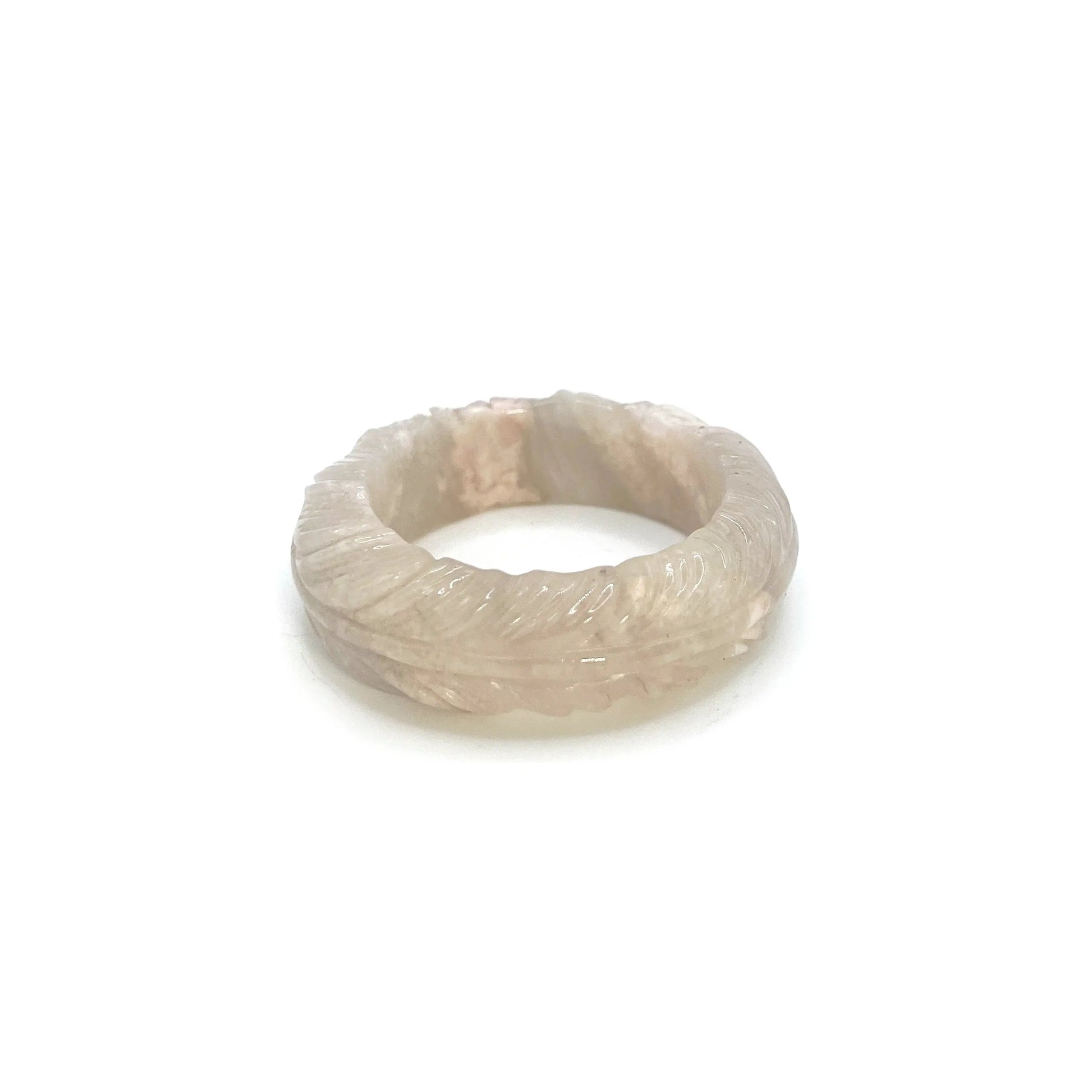 Feather bangle carved from translucent Mongolian jade in ivory, pink, and lavender tones with intricate feather designs and bold, modern shape. - Miruzi