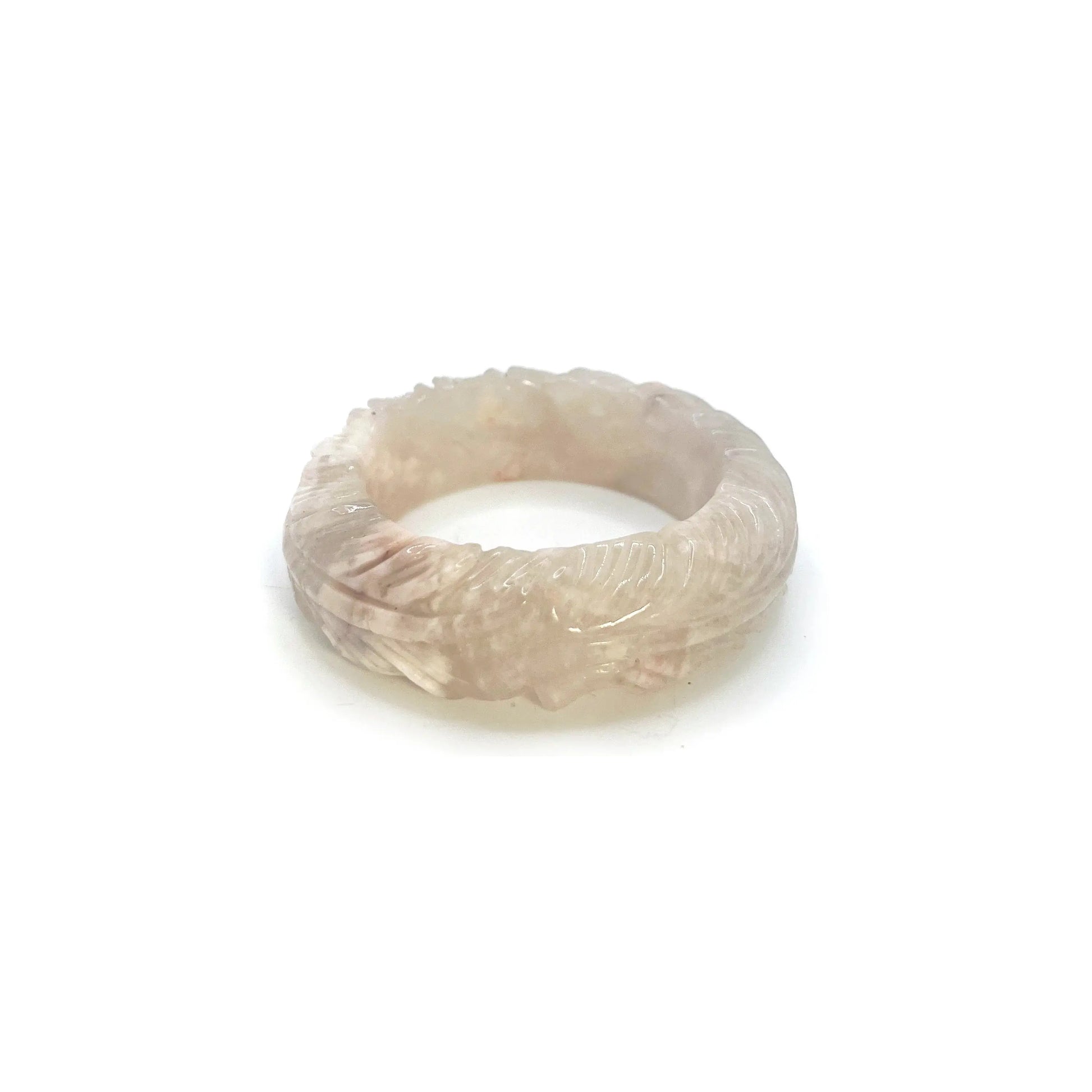 Feather bangle carved from translucent Mongolian jade in ivory, pink, and lavender tones with intricate feather designs and bold, modern shape. - Miruzi