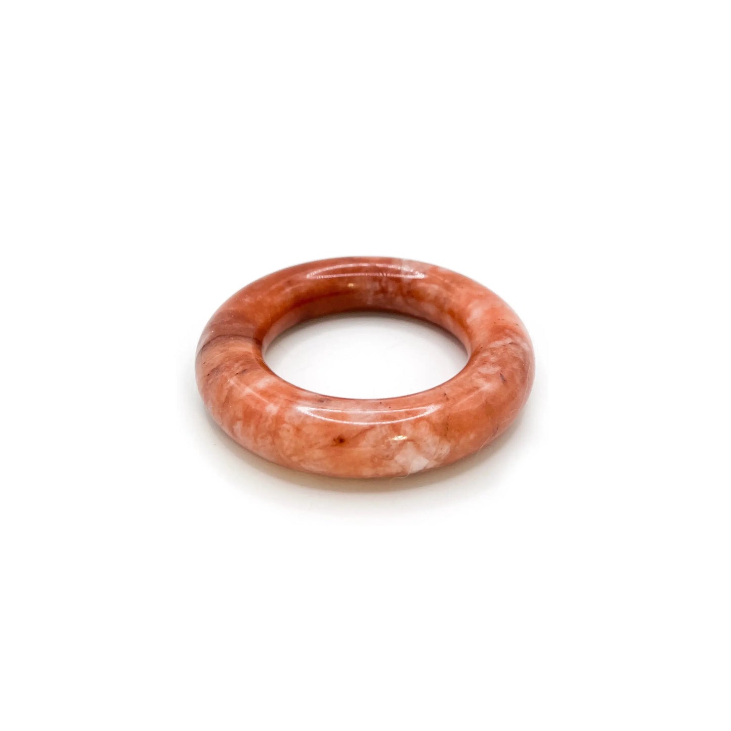 Donut bangle carved from Mongolian jade quartzite in swirling red, pink, and white hues, featuring a smooth round shape and romantic, artistic finish. - Miruzi