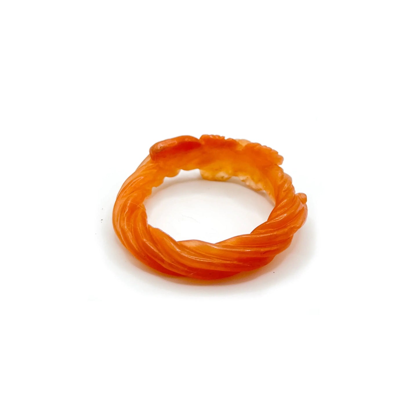 Carved bangle made from translucent Mongolian jade quartzite in orange-yellow tones, featuring delicately etched floral motifs and a glowing, sunset-inspired finish. - Miruzi