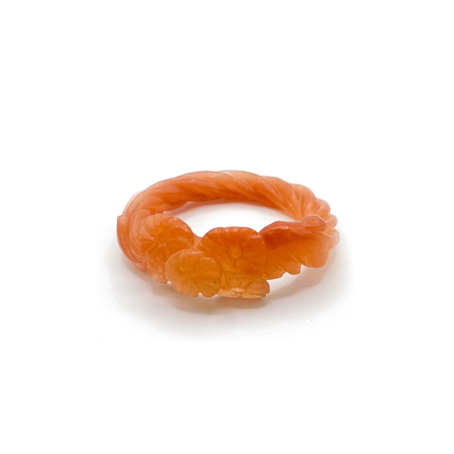 Carved bangle made from translucent Mongolian jade quartzite in orange-yellow tones, featuring delicately etched floral motifs and a glowing, sunset-inspired finish. - Miruzi