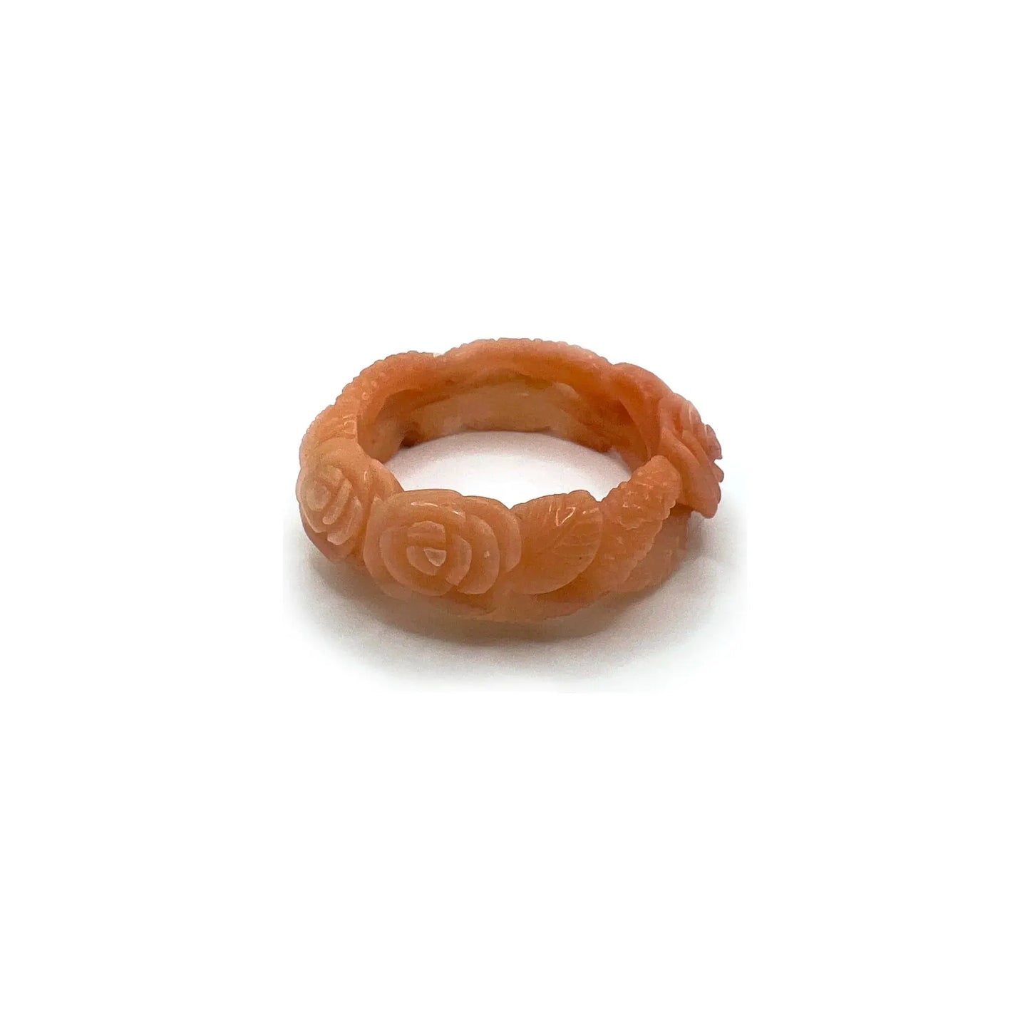 Carved bangle bracelet made from Mongolian jade quartzite, featuring hand-carved roses along a hollowed vine design in soft pink and orange tones.- Miruzi