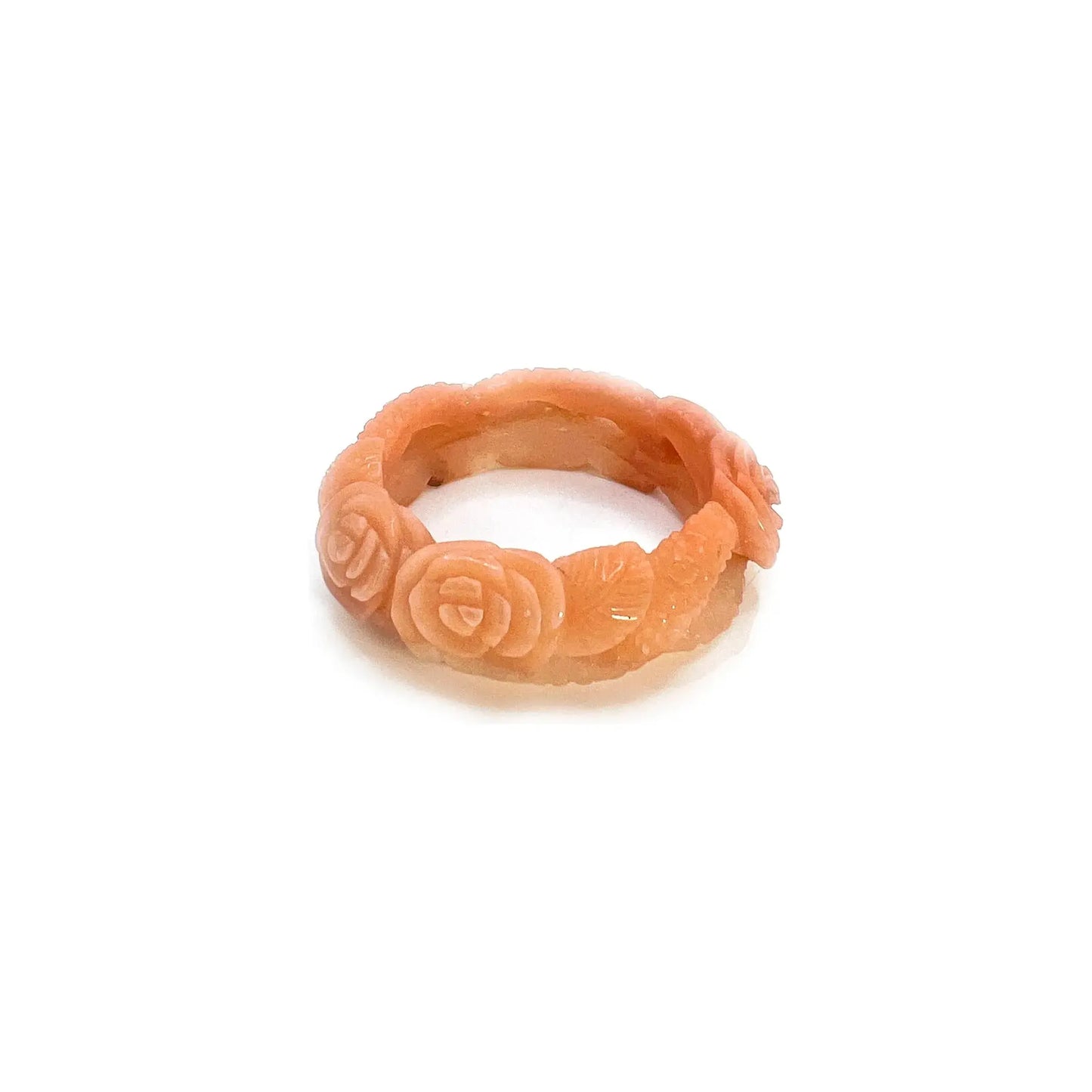 Carved bangle bracelet made from Mongolian jade quartzite, featuring hand-carved roses along a hollowed vine design in soft pink and orange tones.- Miruzi