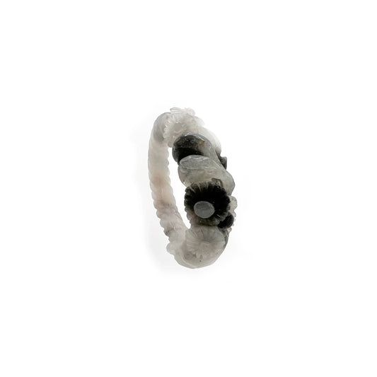 Daisy bangle made from Mongolian jade quartzite, featuring hand-carved white floral motifs that glow like blossoms under moonlight. - Miruzi