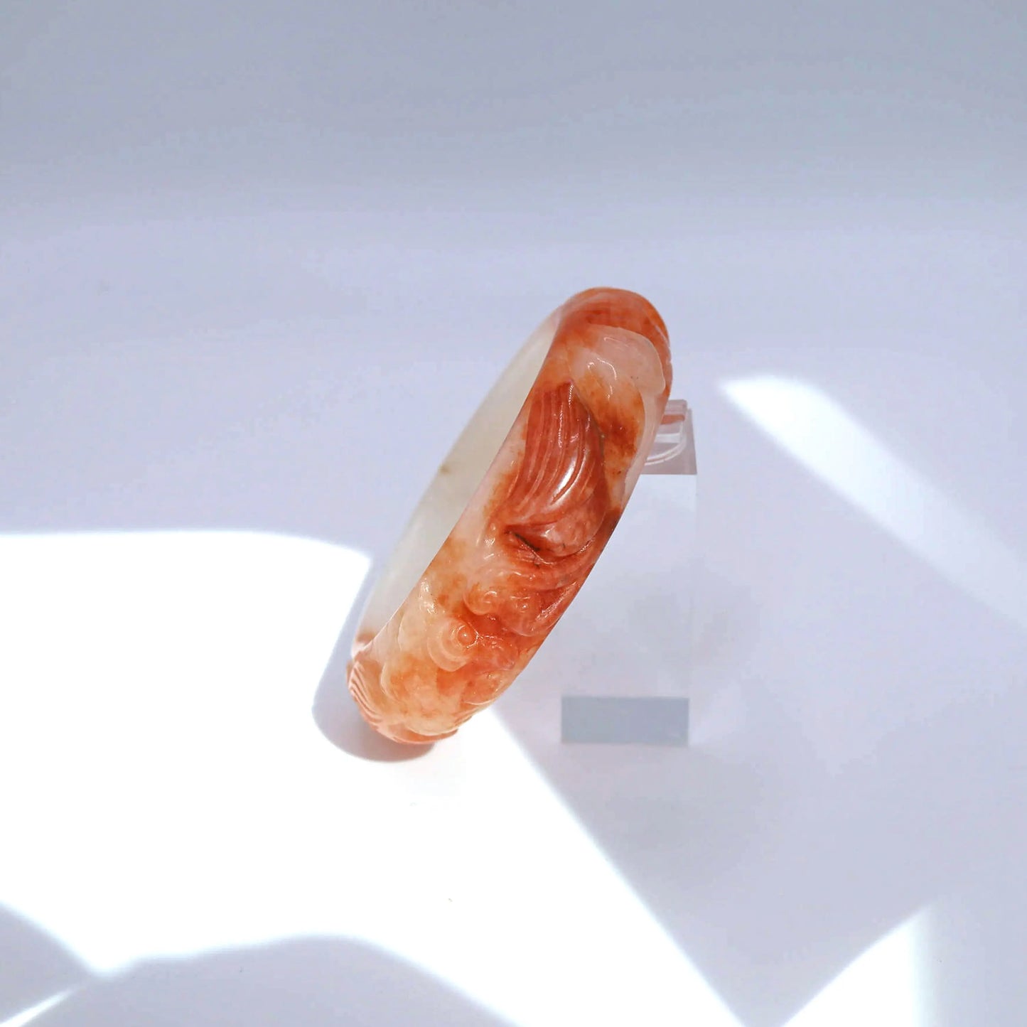 Small-size handcrafted jade bangle with vivid orange and milky white blend, designed for petite wrists