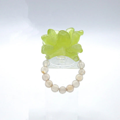 Adjustable Summer Peony Dream Ring crafted from translucent serpentine with a lemon yellow tint, featuring a beautifully carved three-dimensional peony, symbolizing prosperity and romance. Perfect for pairing with summer dresses, this ring combines elegance and a vibrant summer theme.