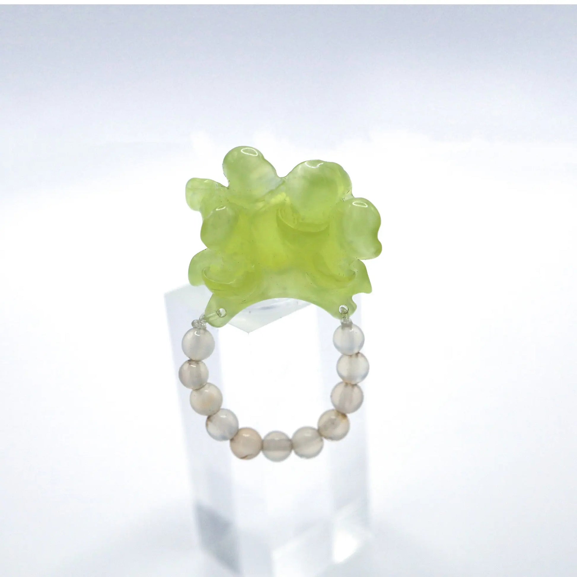Adjustable Summer Peony Dream Ring crafted from translucent serpentine with a lemon yellow tint, featuring a beautifully carved three-dimensional peony, symbolizing prosperity and romance. Perfect for pairing with summer dresses, this ring combines elegance and a vibrant summer theme.