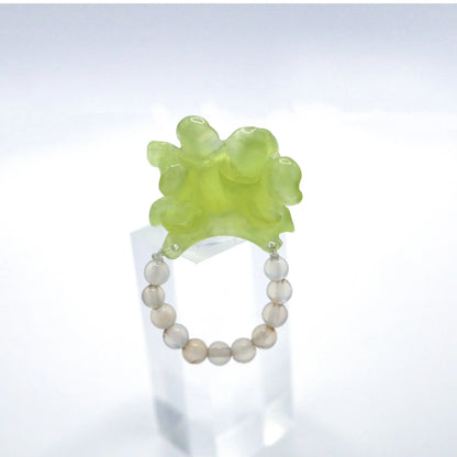 Adjustable Summer Peony Dream Ring crafted from translucent serpentine with a lemon yellow tint, featuring a beautifully carved three-dimensional peony, symbolizing prosperity and romance. Perfect for pairing with summer dresses, this ring combines elegance and a vibrant summer theme.