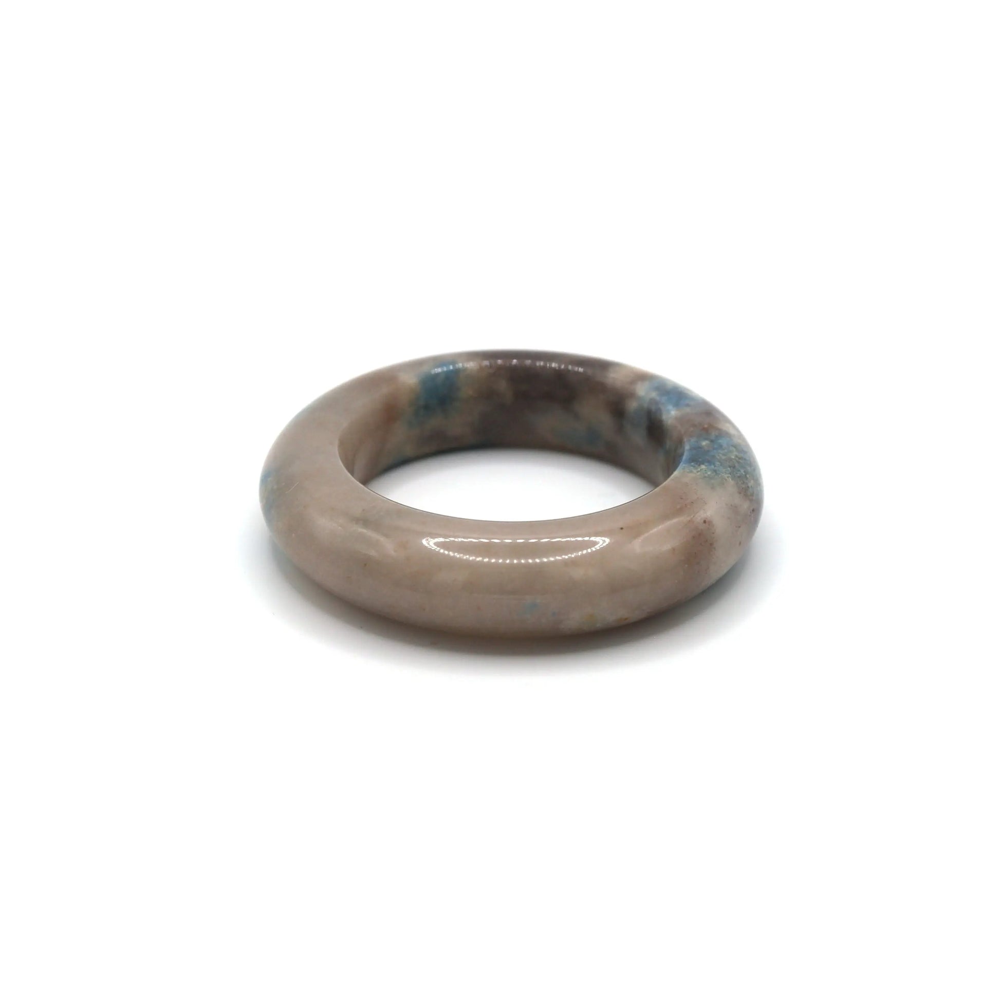 White jade bangle with blue and lilac marble-like areas, echoing serene skies and quiet elegance in natural stone texture – Miruzi