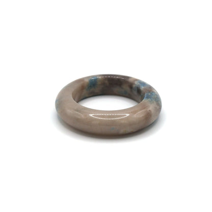 White jade bangle with blue and lilac marble-like areas, echoing serene skies and quiet elegance in natural stone texture – Miruzi