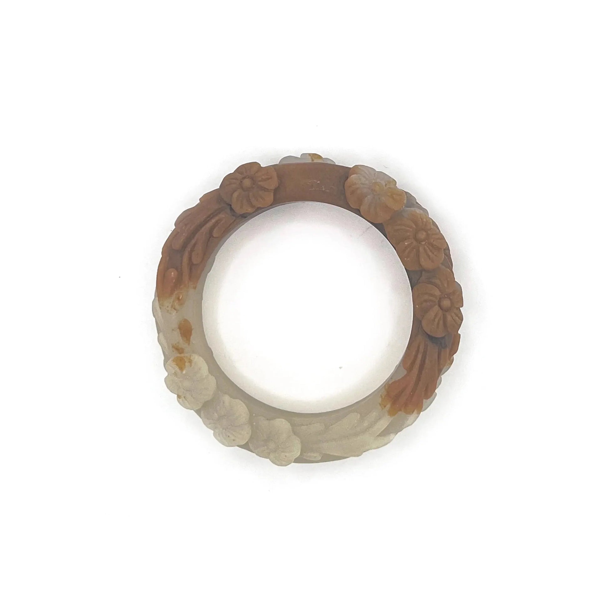 Carved jade bangle featuring three-dimensional floral motifs in warm caramel-colored Mongolian quartzite, hand-carved with an earthy and elegant finish.