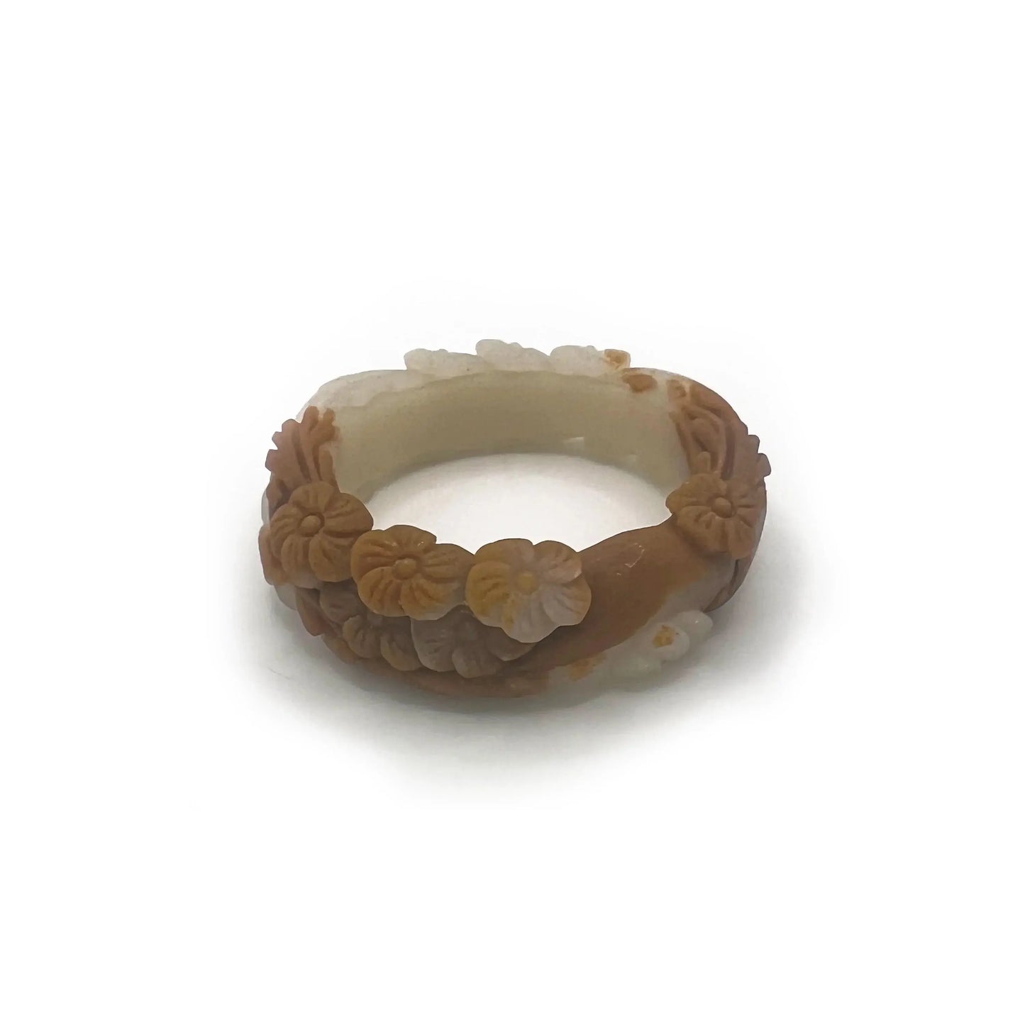 Carved jade bangle featuring three-dimensional floral motifs in warm caramel-colored Mongolian quartzite, hand-carved with an earthy and elegant finish.