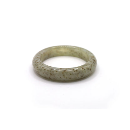 Delicate beige jade bracelet with soft brown flecks resembling dried petals, glowing with a translucent finish and natural charm – Miruzi
