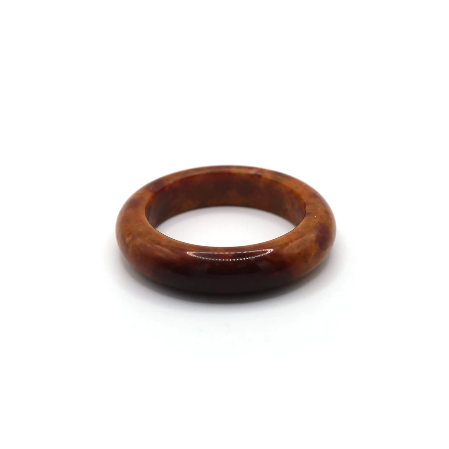 Female wrist wearing red jade bracelet with elegant neutral-toned outfit Miruzi