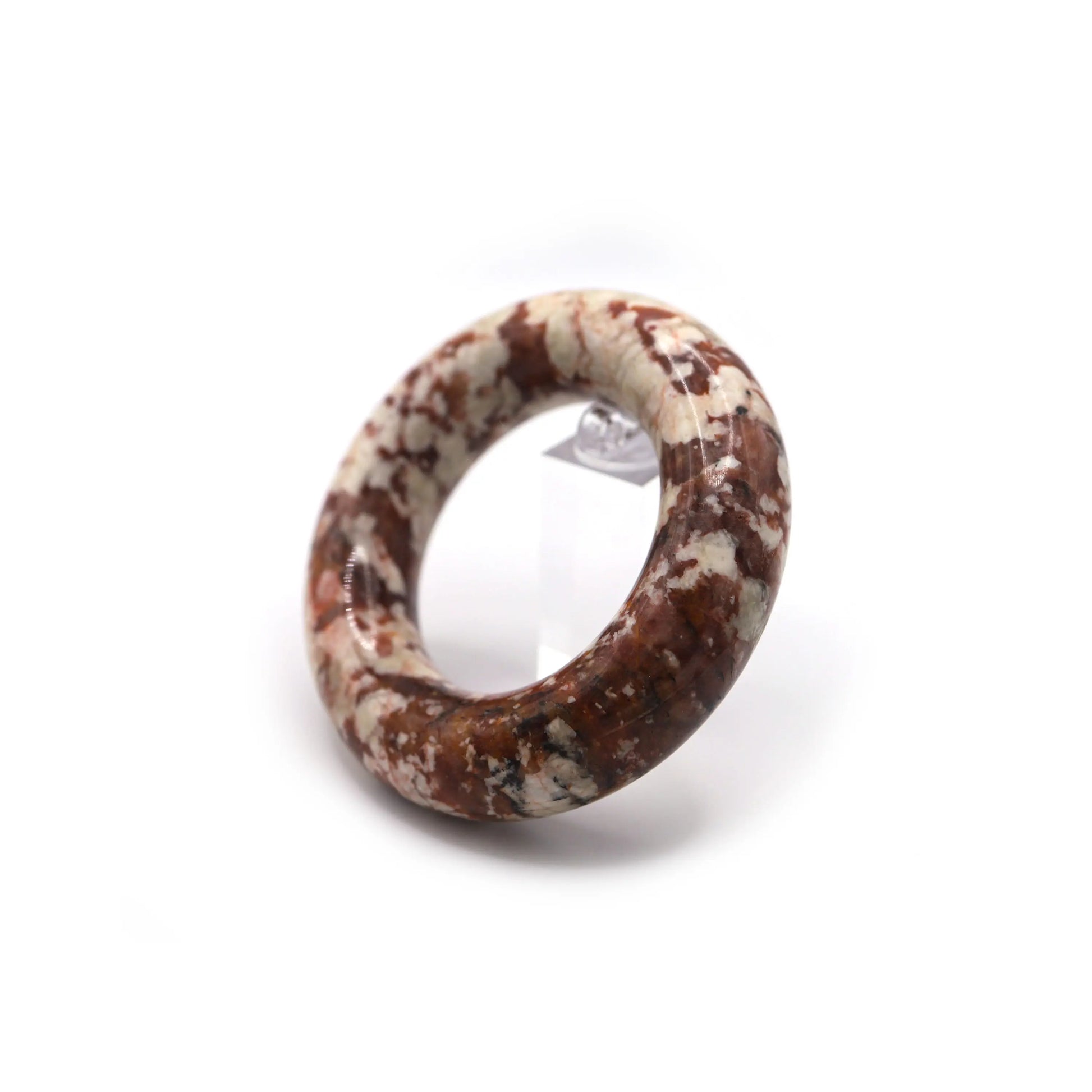 Close-up of red quartzite jade bracelet with organic white specks dotting the surface like festive petals in full bloom – Miruzi