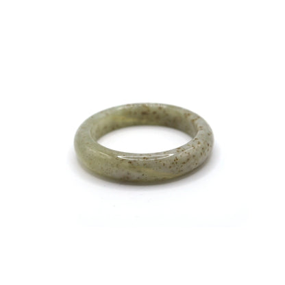 Jade bracelet with a see-through beige base and gentle mineral blooms, each fleck creating a unique floral rhythm – Miruzi