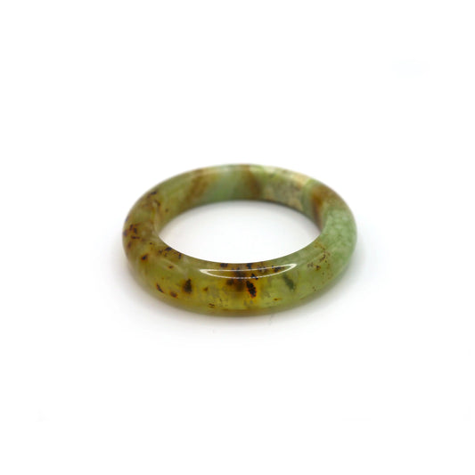  Close-up of jade bangle showing soft cotton-like mineral formations inside the stone - Miruzi