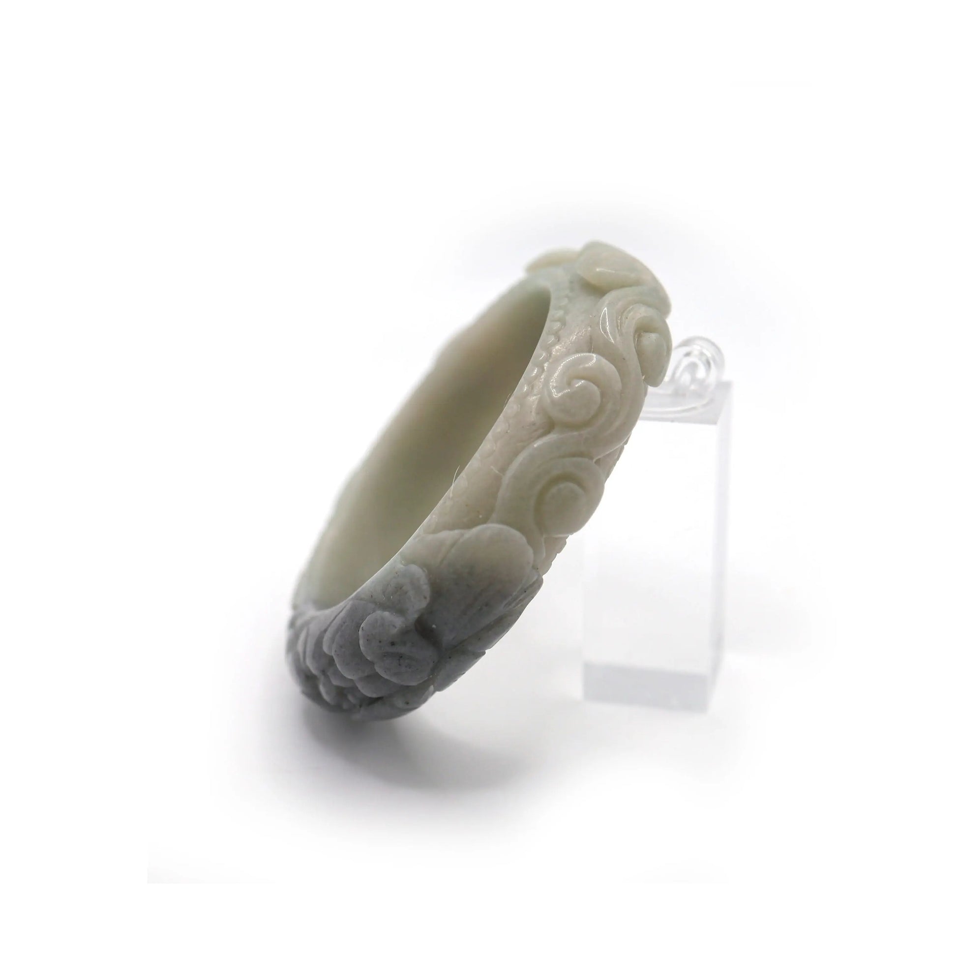Artisan jade bracelet with raised cloud forms and a striking dark peony centerpiece, softly polished for serene and noble character – Miruzi
