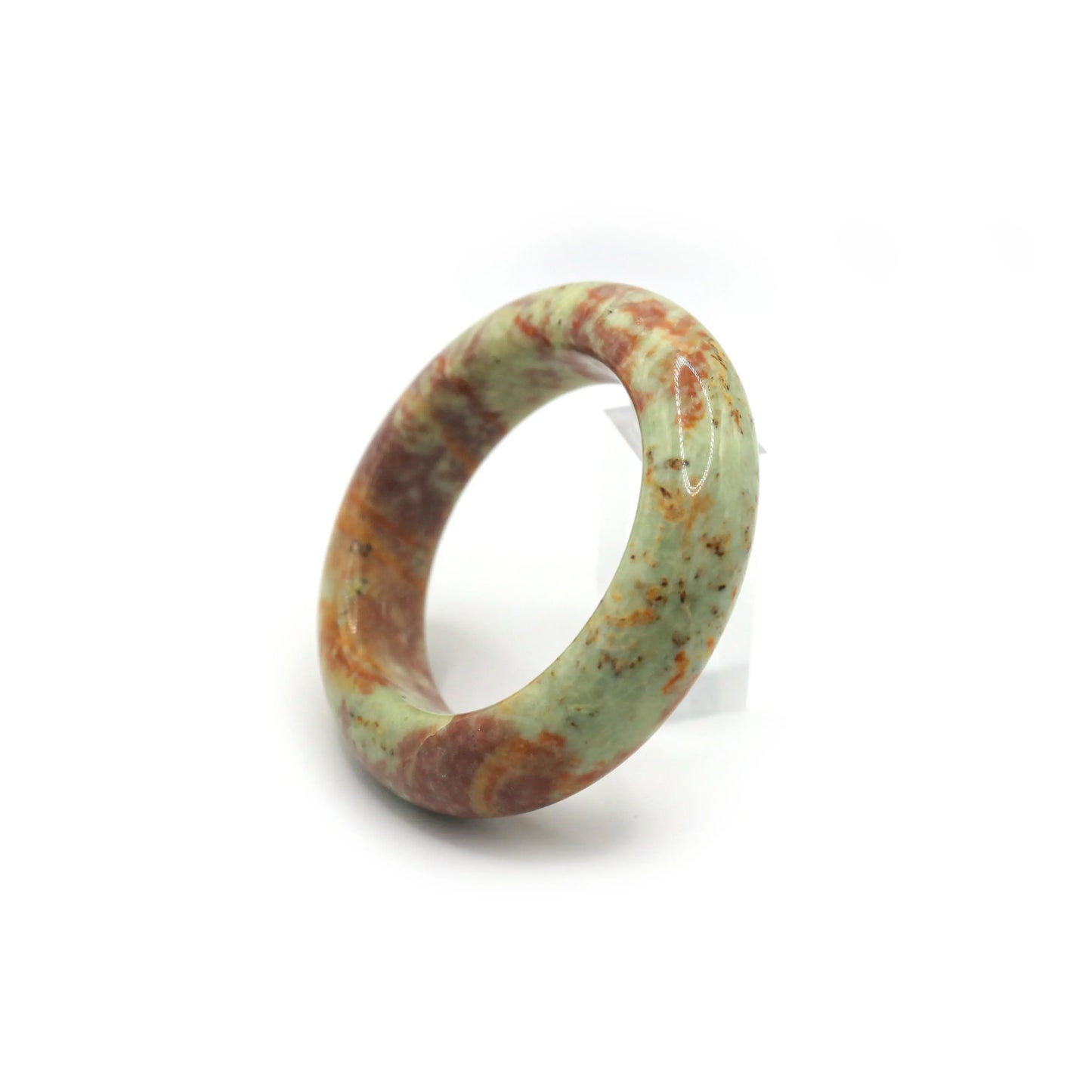 Multi-color jade bangle glowing in daylight, highlighting organic stone patterns Miruzi