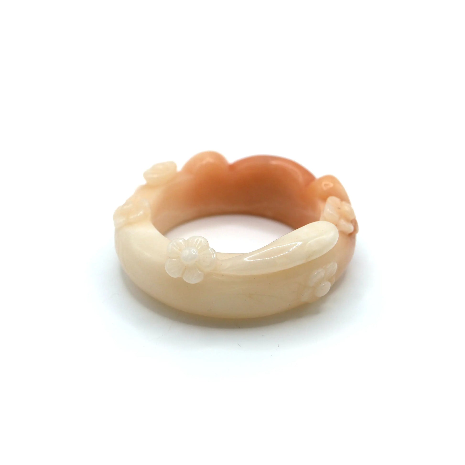 Elegant cat bracelet in soft coral jade with floral sculpting and a subtle hand-carving mark that doesn’t affect wear – Miruzi