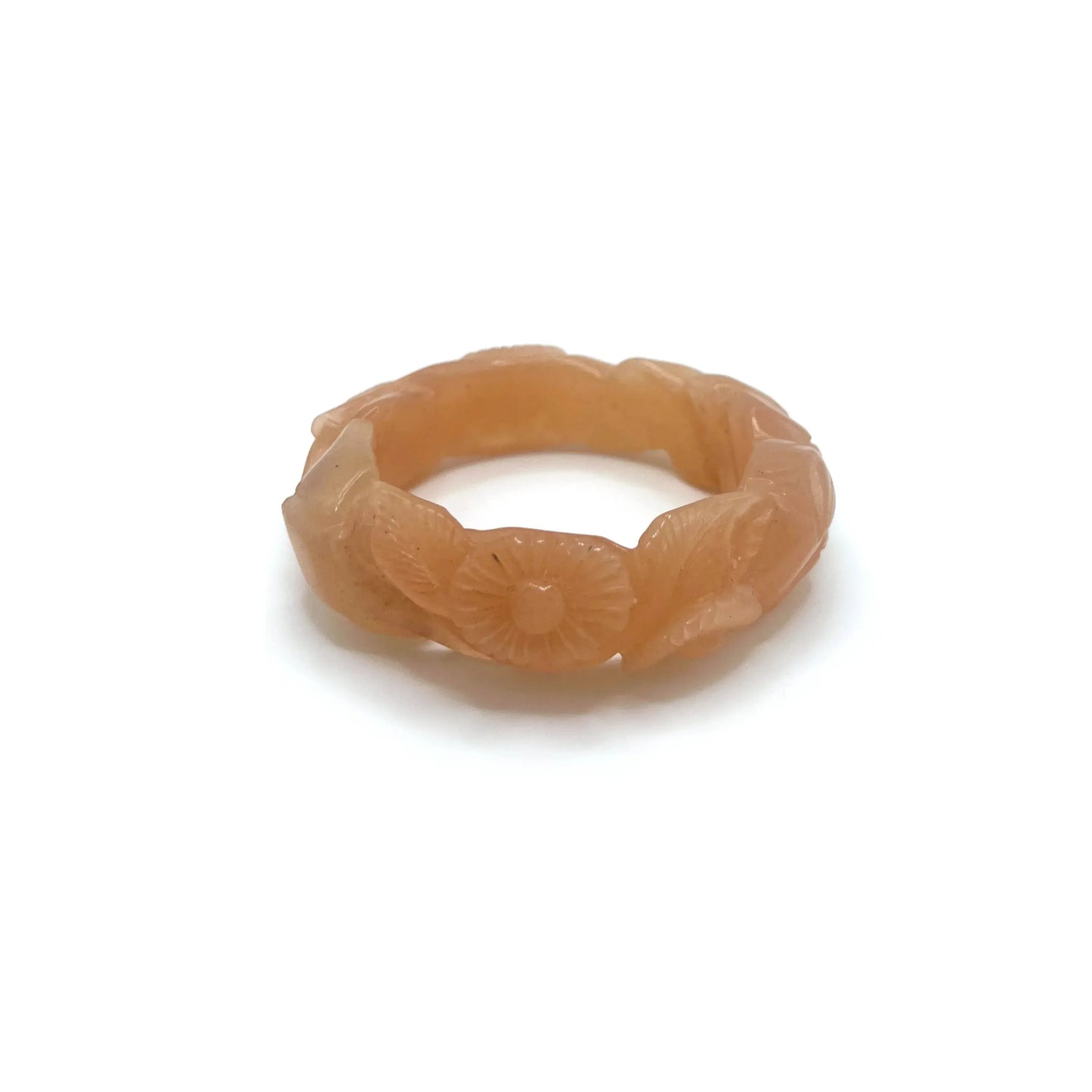Twisted orange jade daisy bangle bracelet, showcasing a radiant blend of amber and blush tones in a playful, nature-inspired design.