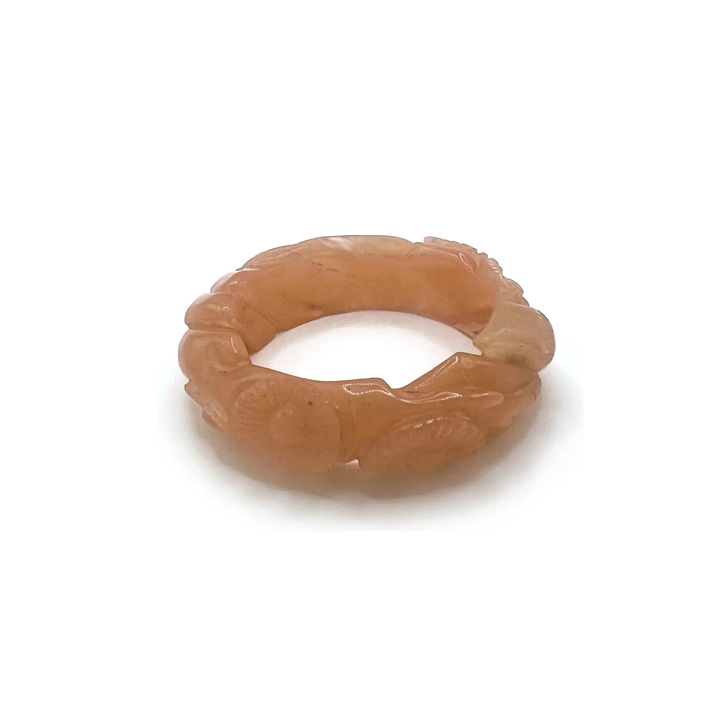 Twisted orange jade daisy bangle bracelet, showcasing a radiant blend of amber and blush tones in a playful, nature-inspired design.