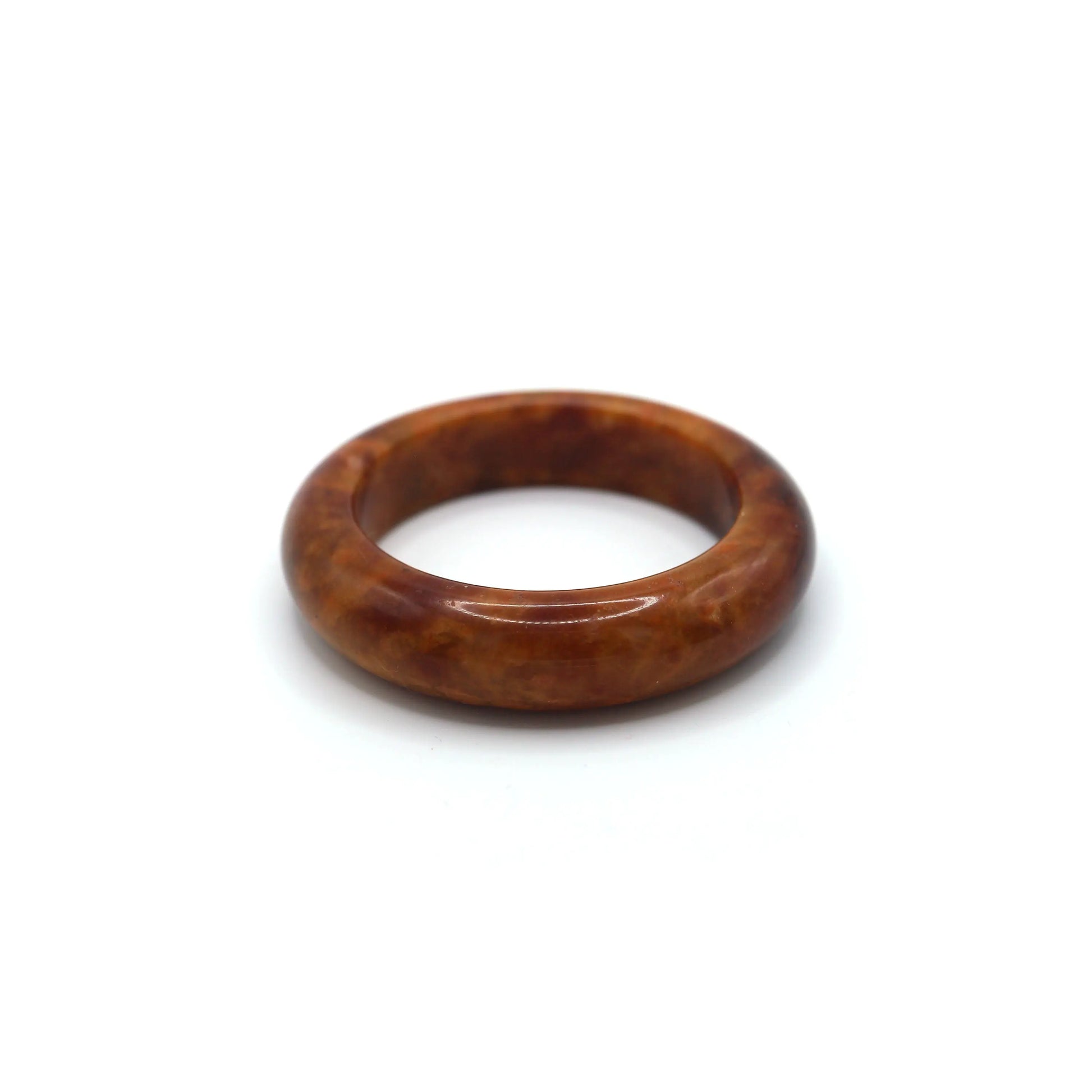 Crimson jade bracelet inside a soft jewelry pouch showing natural variations Miruzi