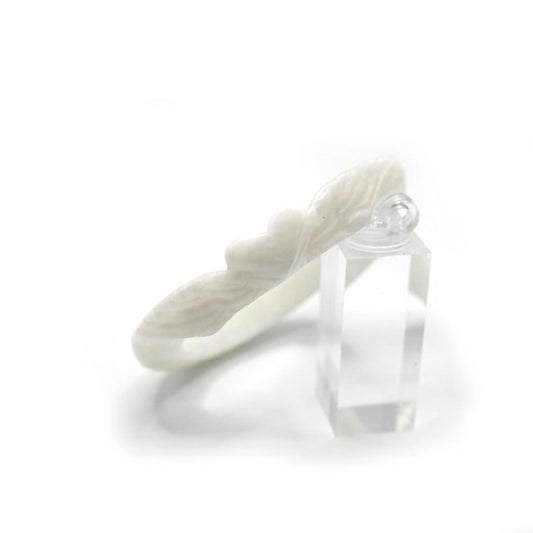 Hand-carved quartzite jade bangle with a central heart motif and flowing feather accents, expressing quiet love and protection – Miruzi