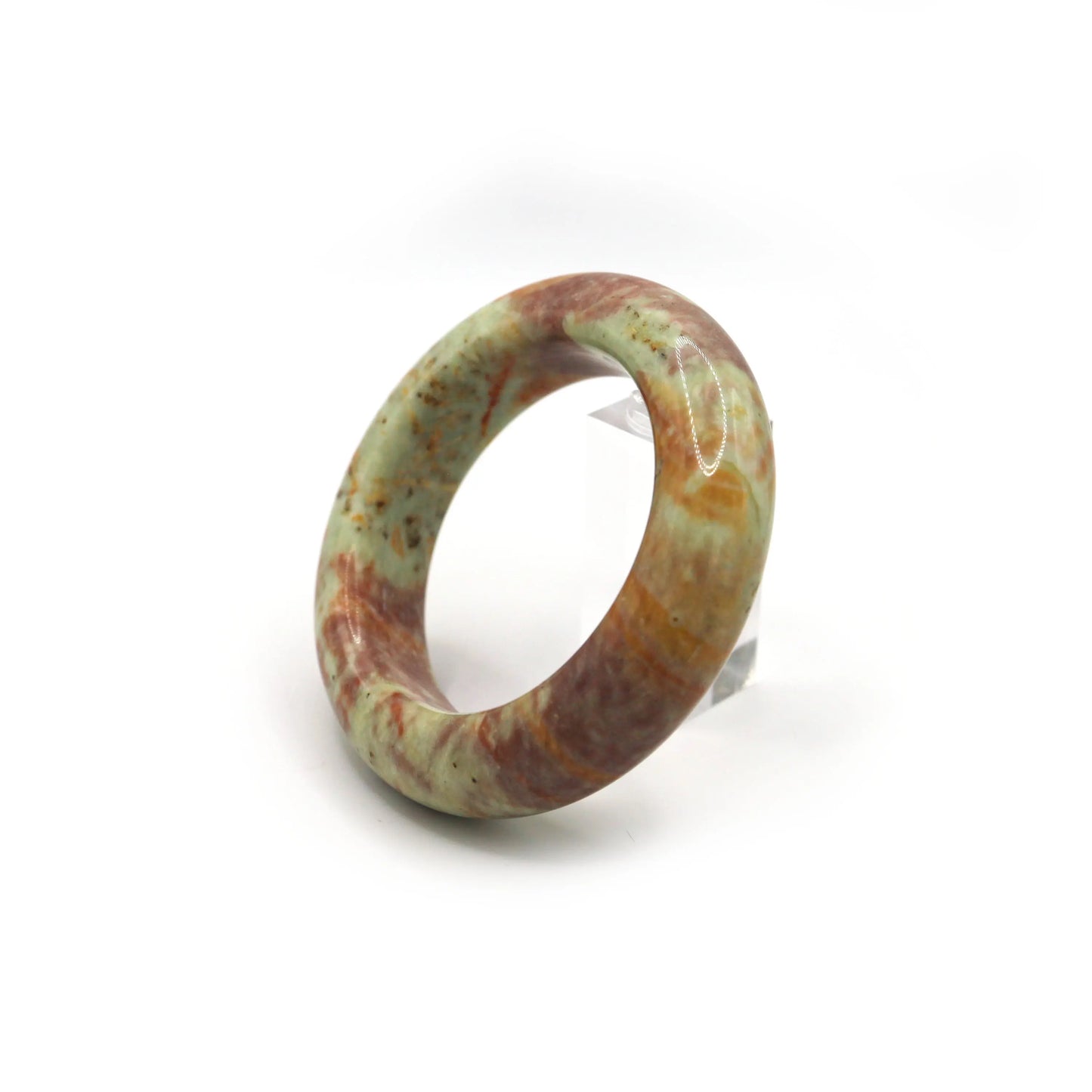 Female wrist wearing pink and green jade bangle with olive linen outfit Miruzi