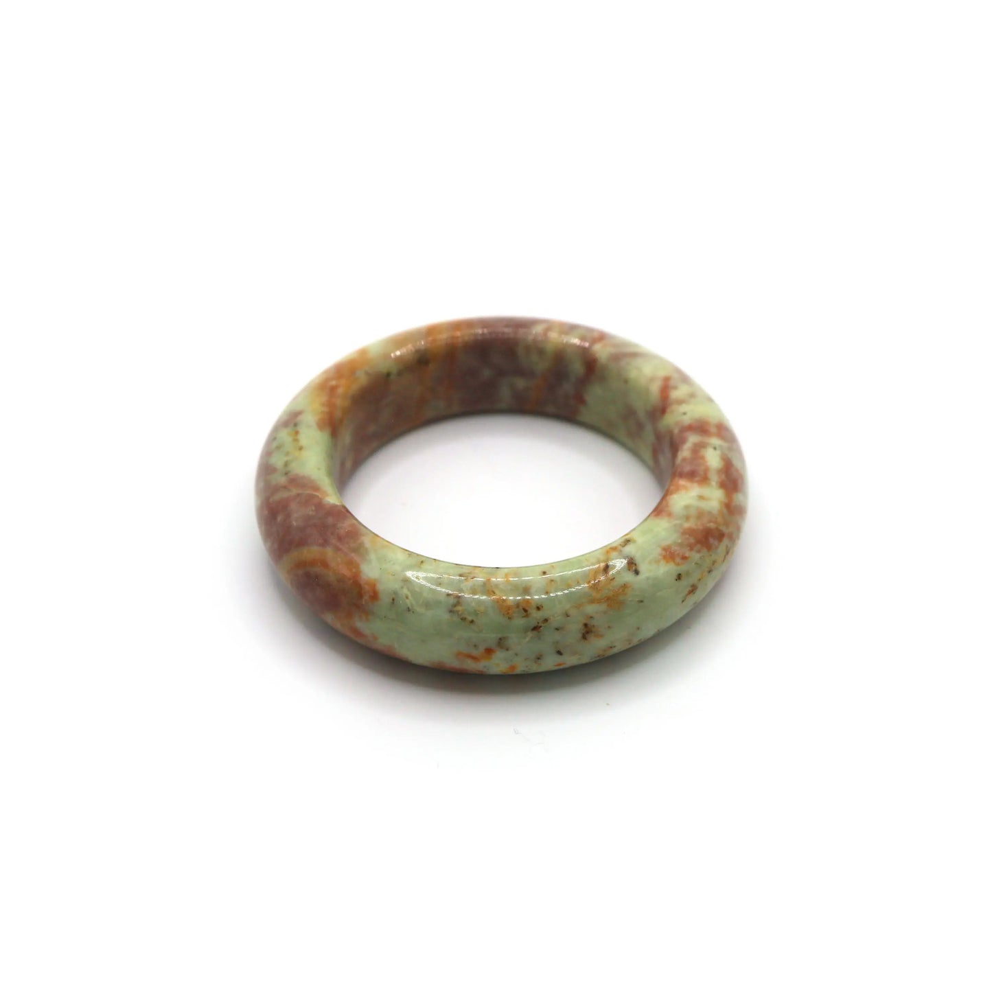 Jade bangle styled with clay-colored silk and cream knit textiles Miruzi