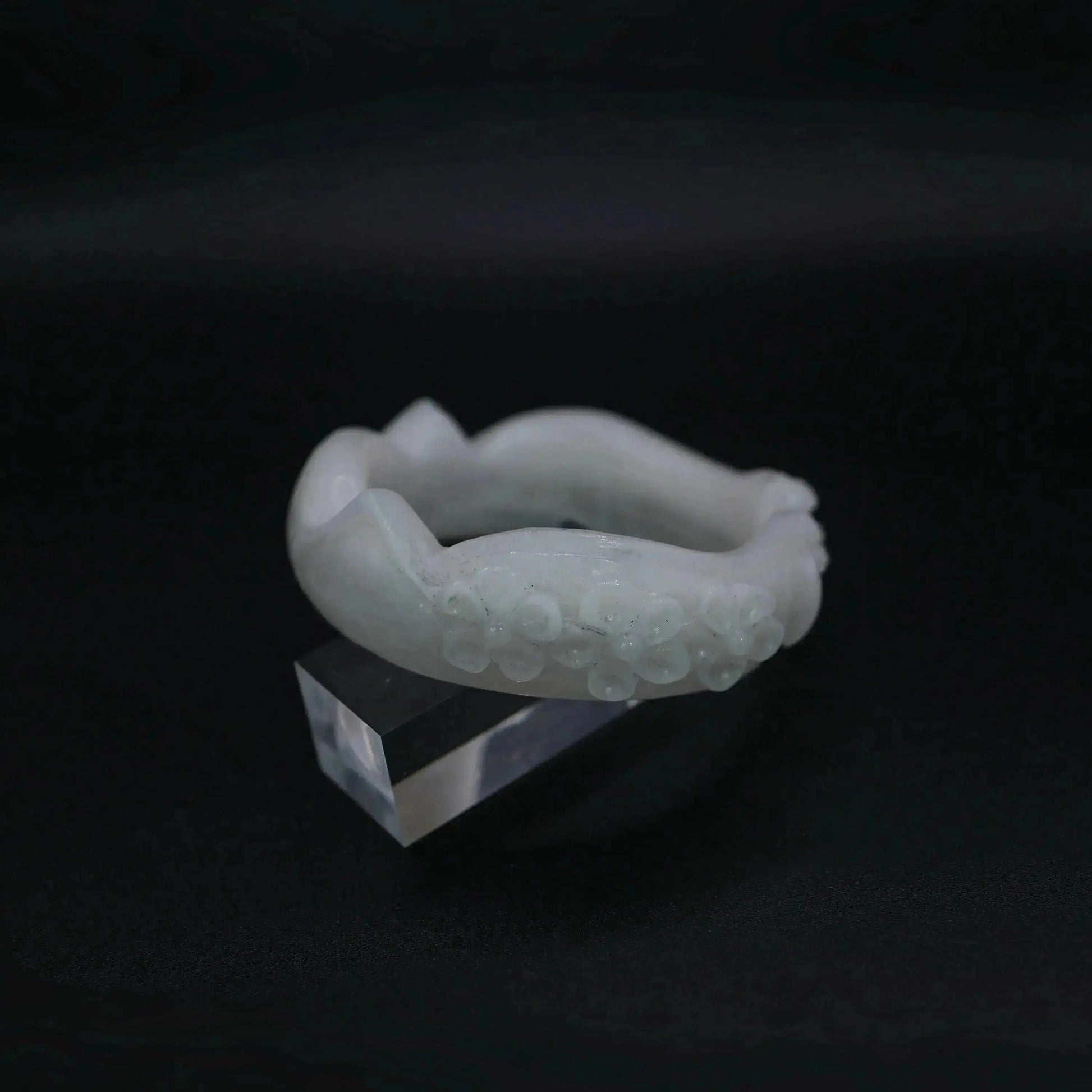 A sculptural white jade bracelet featuring refined feline and floral details in a full-circle, hand-polished silhouette – Miruzi

