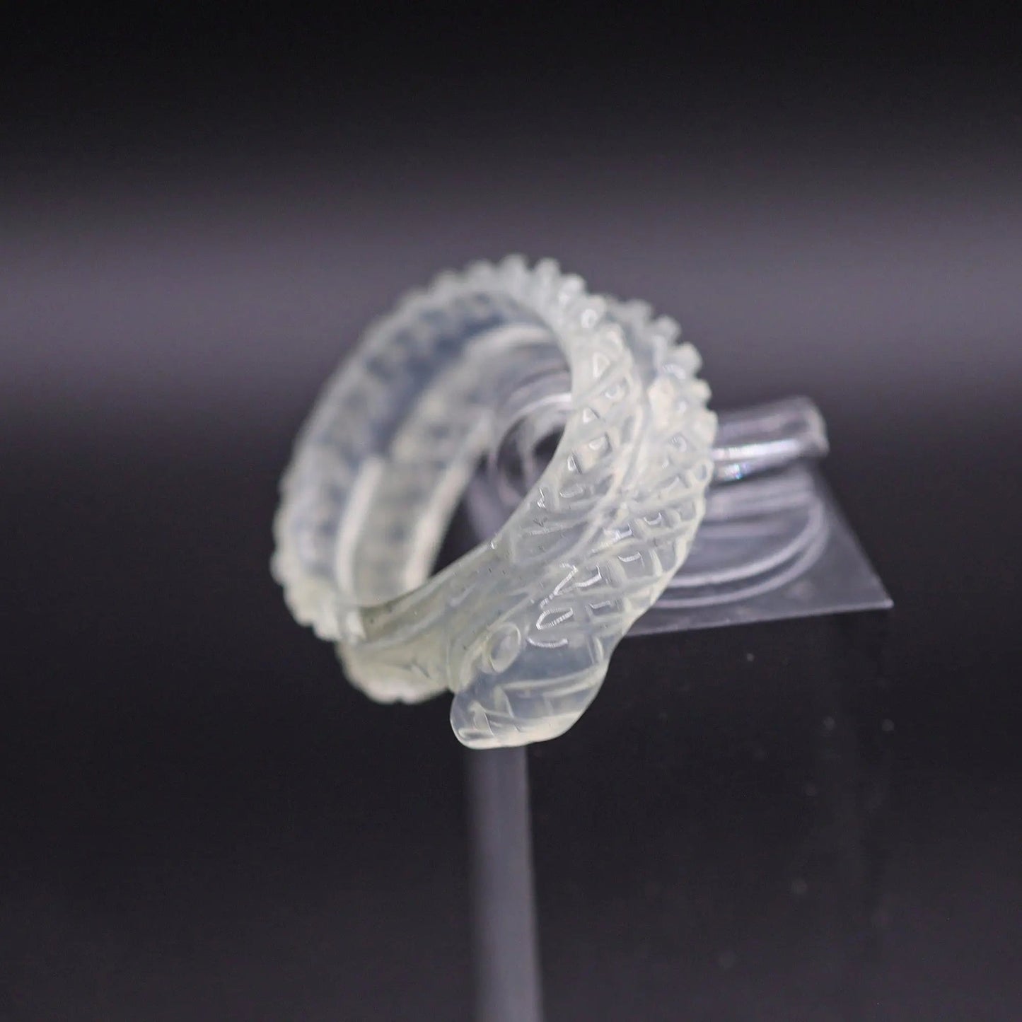 Ethereal Serpent Ring with icy white serpentine, delicately carved snake design, symbolizes wisdom and rebirth.